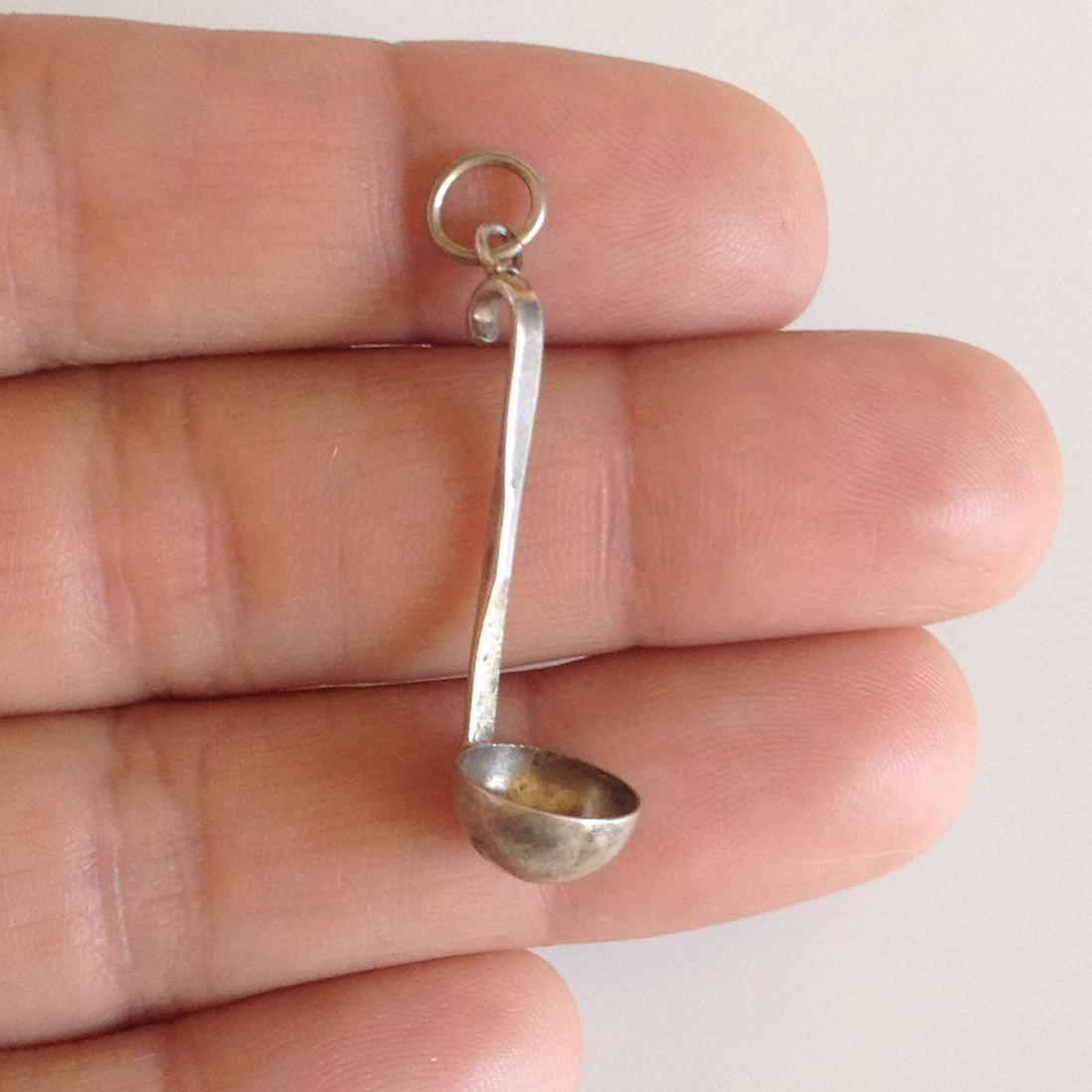 Sterling silver Ladle Kitchen Utencil pendant charm: Sterling silver Ladle Kitchen Cooking Utencil pendant charm. Weight 0.75 grams. Hallmarked 925. Length 1 1/2 inches with bail. Condition excellent.