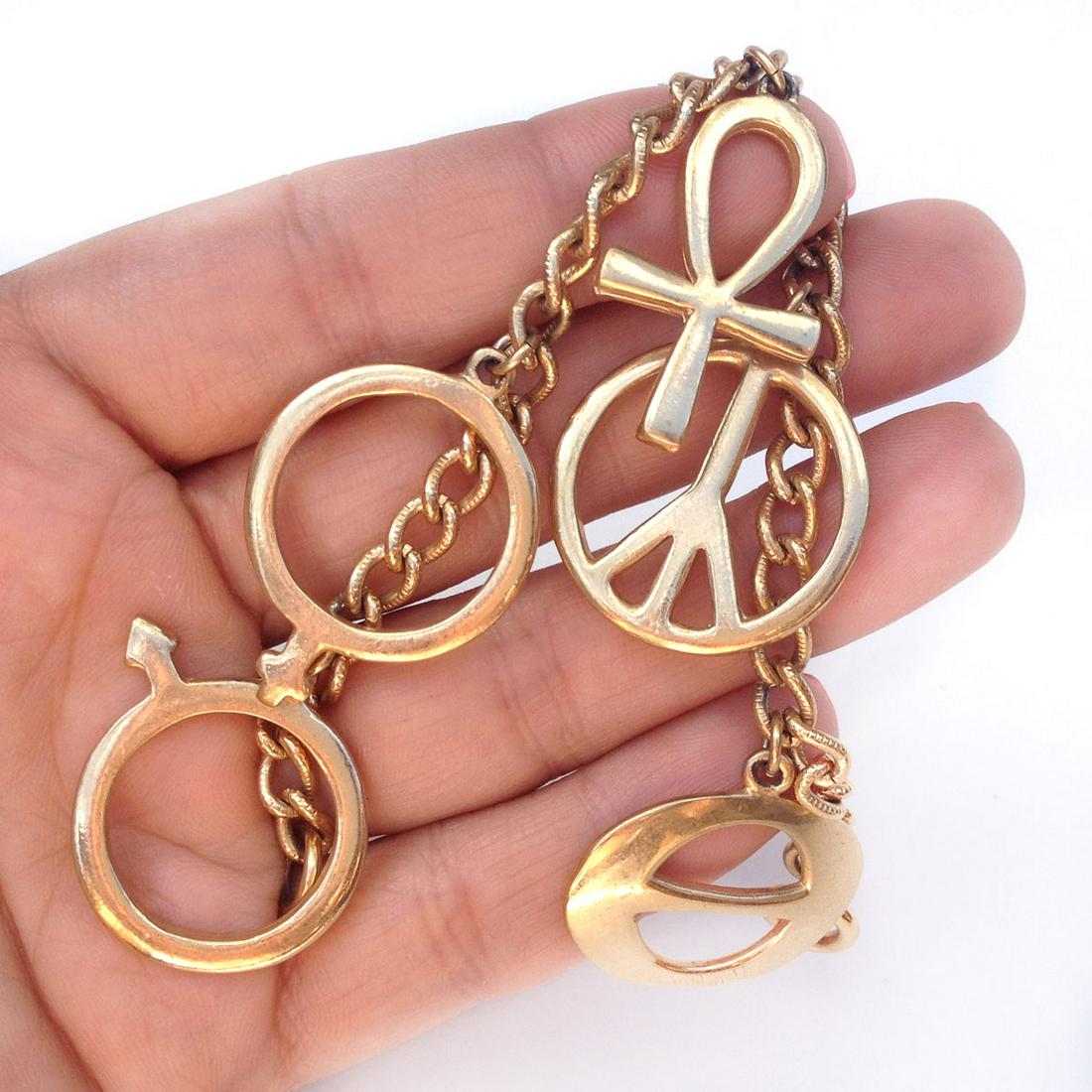 Vintage gold tone Ankh Peace Man Woman sign bracelet: Vintage gold ton Ankh Peace Man Woman sign bracelet. Length 7 inches. Condition very good.