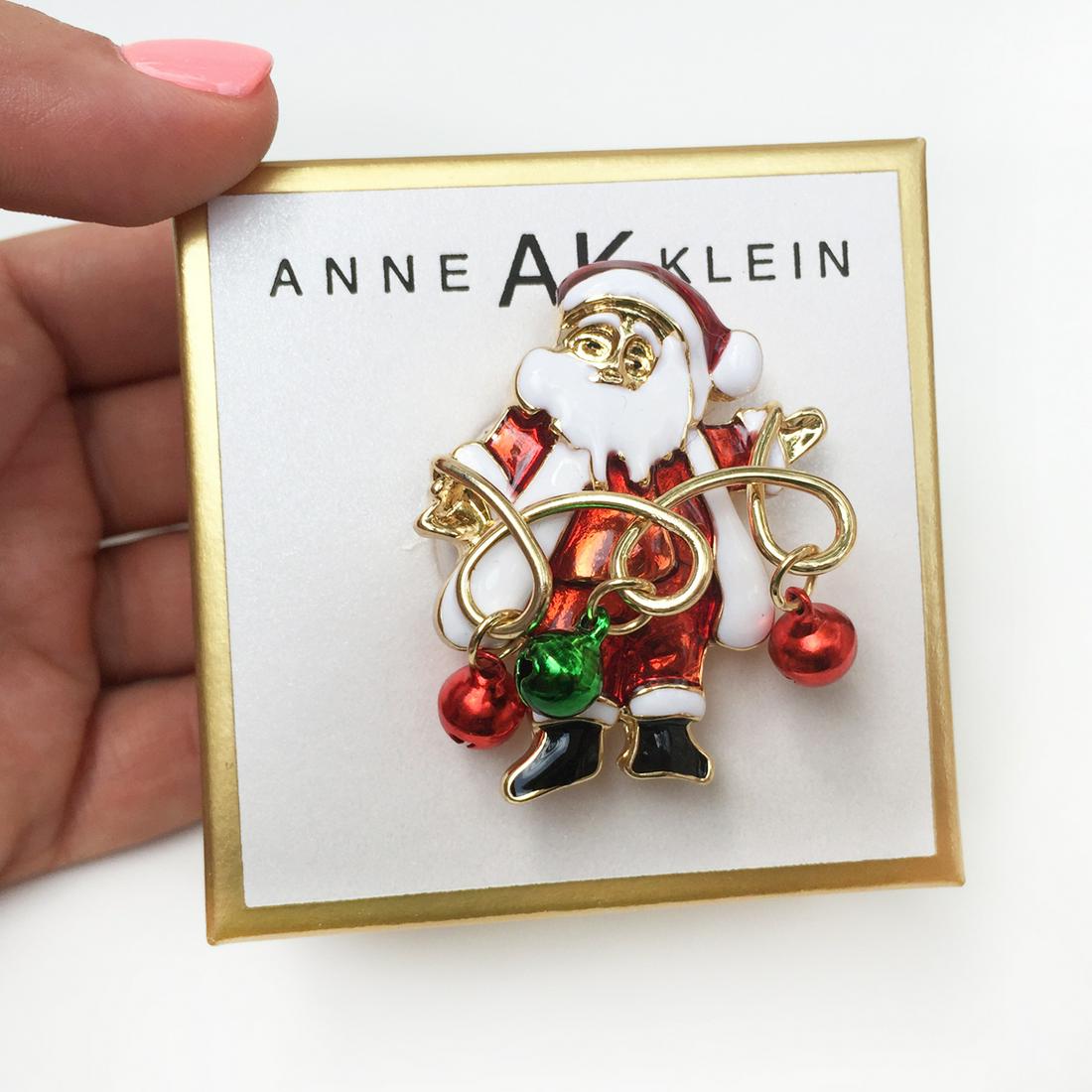 ANNE KLEIN Gold tone Santa Clause bells enamel brooch: ANNE KLEIN Gold tone Santa Clause bells enamel brooch. Measured 1 3/4 x 1 1/2 inches. Condition excellent.