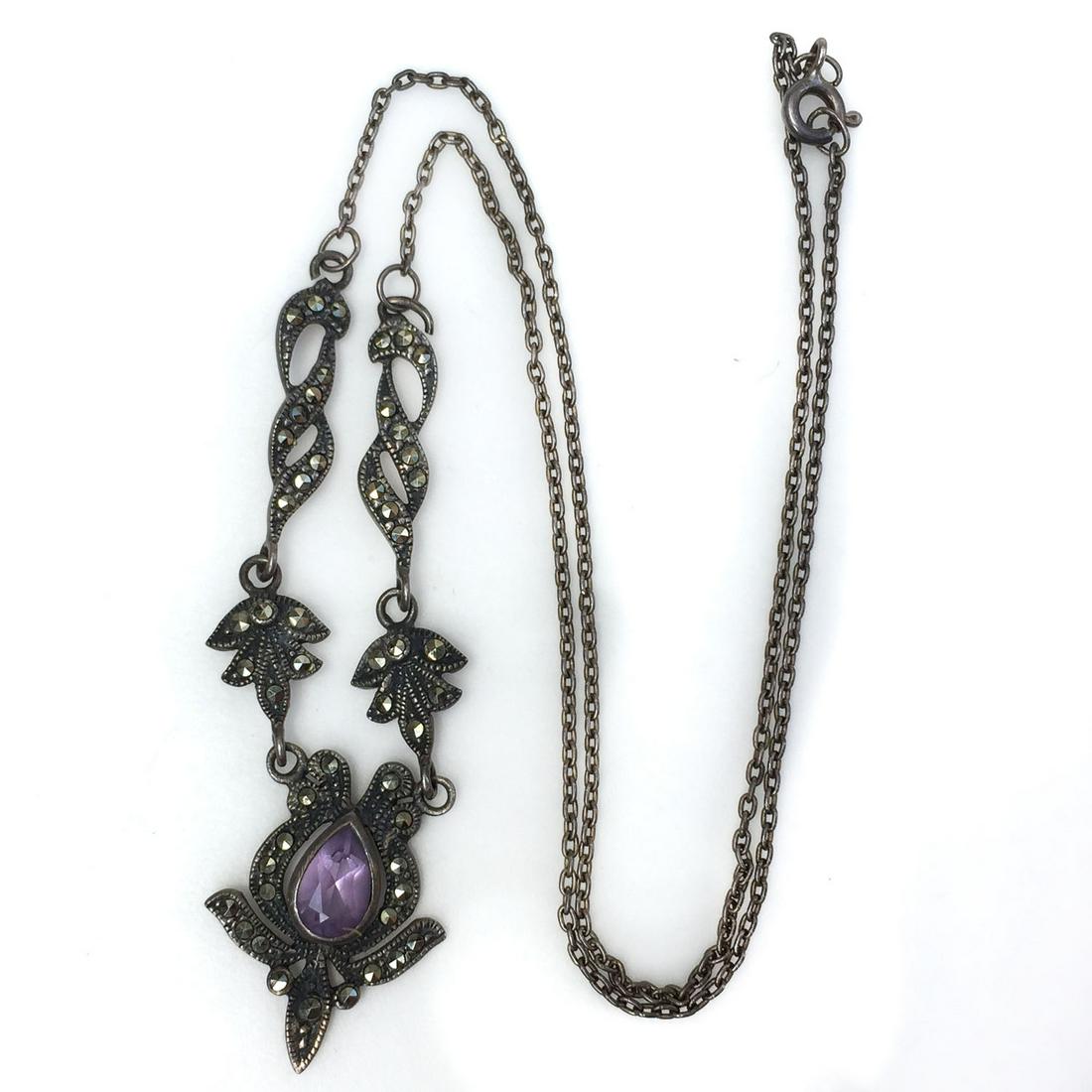 Vintage sterling silver amethyst pendant necklace: Vintage sterling silver pear shape faceted amethyst marcasites pendant necklace. Weight 5.83 grams. Hallmarked 925. Necklace length 16 1/2 inches. "Pendant" length 7/8 inches. Condition very good.