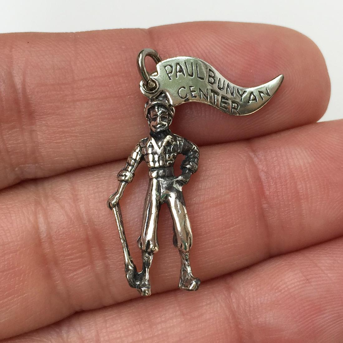 Sterling silver Paul Bunyan Center Lumberjack charm: Sterling silver Paul Bunyan Center Lumberjack charm pendant. Weight 2.12 grams. Hallmarked Sterling. Length 1 1/8 inches with bail. Condition excellent.