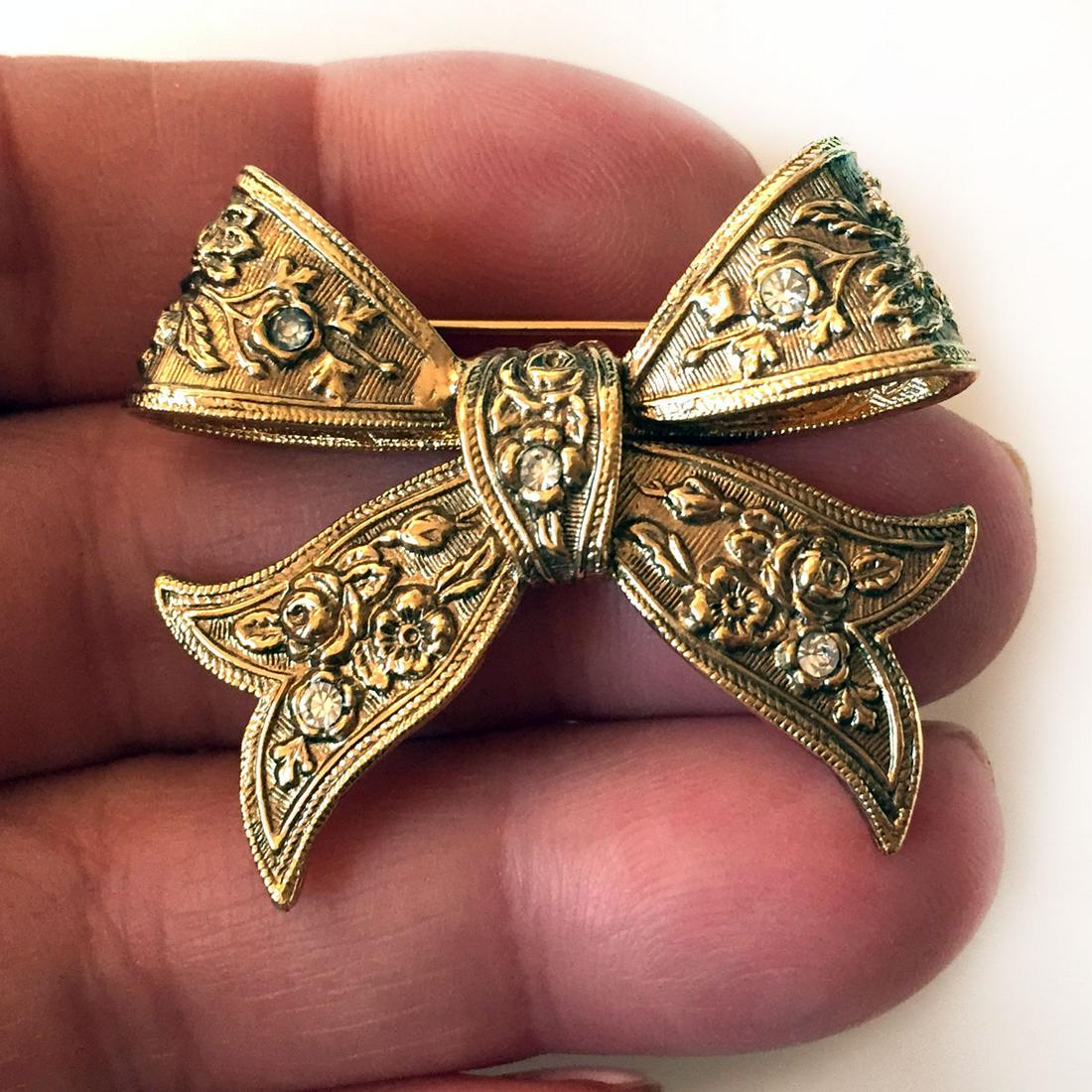 Gold tone Bow shape brooch with clear crystals (1 of 3)