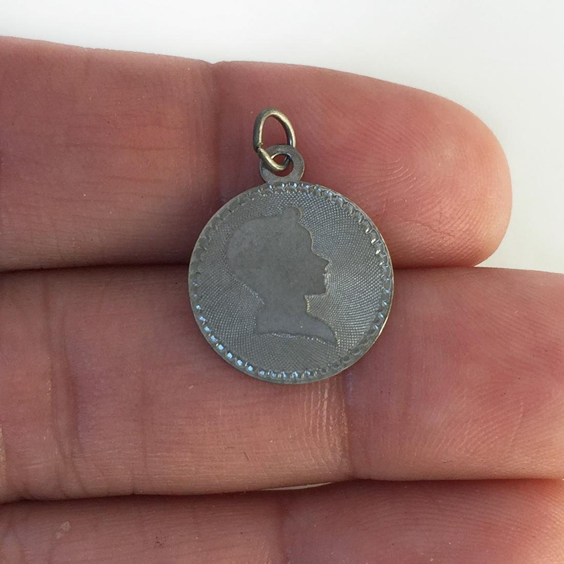 JJJ vintage sterling silver Boy's profile round pendant: JJJ vintage sterling silver Boy's profile Head textured and shiny finish round pendant, signed. Weight 0.80 grams. Length 3/4 inches with bail. Hallmarked JJJ Sterling. Condition very good.