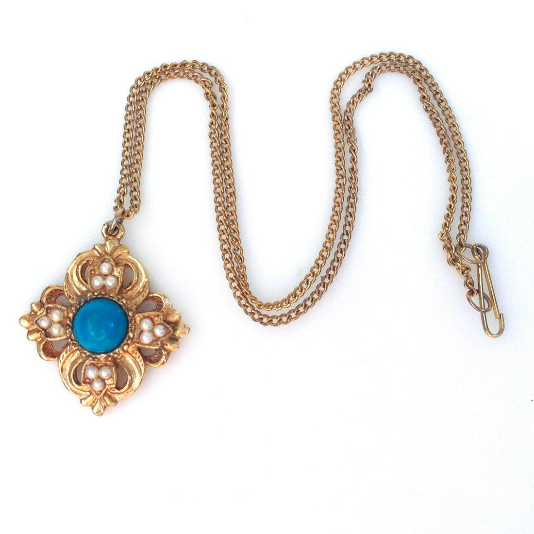 Vintage gold tone turquoise color cab pendant chain: Vintage gold tone turquoise color cabochon and white faux pearl pendant and chain. Chain length 16 inches. Pendant length 1 1/4 inches with bail. Condition excellent.