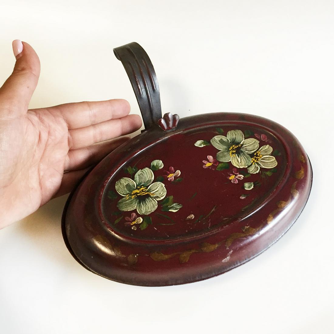 Vintage red painted flower oval shape Silent Butler: Vintage red painted flower oval shape Silent Butler, crumb catcher. Measured 8 1/4 x 5 1/4 inches. Condition good.