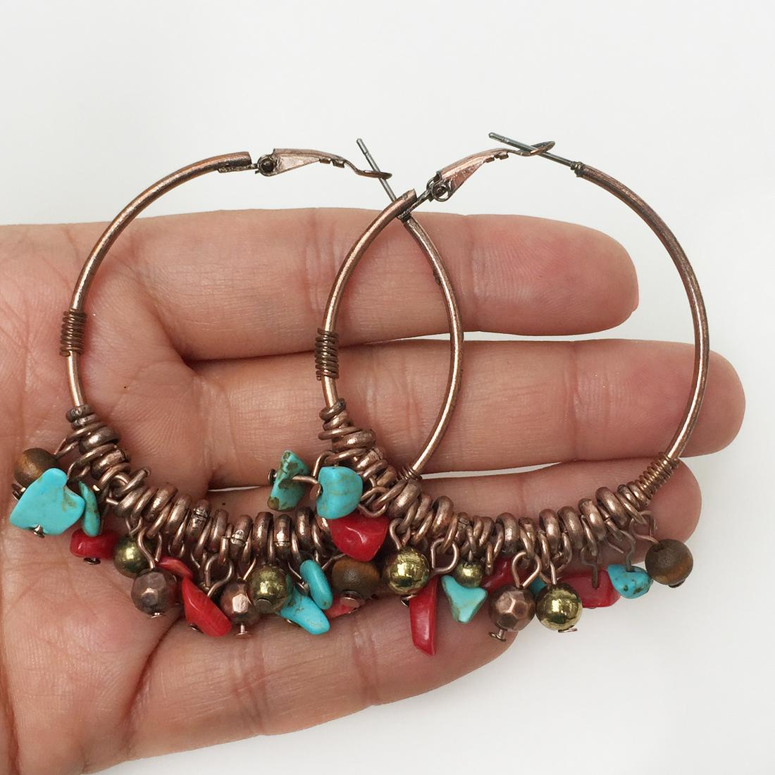Copper tone turquoise color, coral color chip earrings: Copper tone blue turquoise color, red coral color chips, metal and wood beads hoop earrings. Length 2 inches. Condition very good.