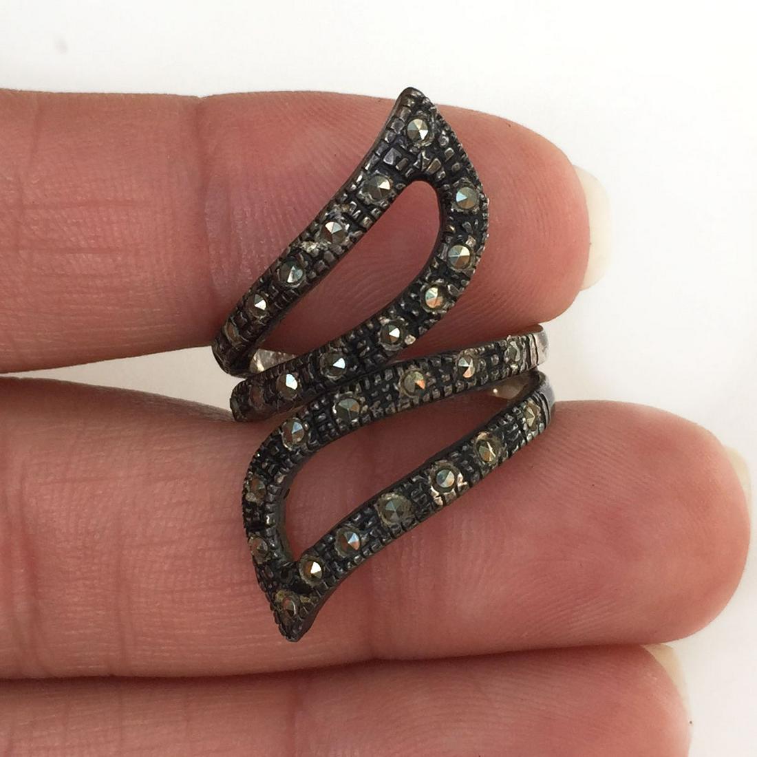 Sterling silver marcasites Leaf Wave ring: Sterling silver marcasites Leaf Wave ring. Ring size adjustable from 8 to 10. Weight 5.40 grams. Hallmarked 925. Condition very good.