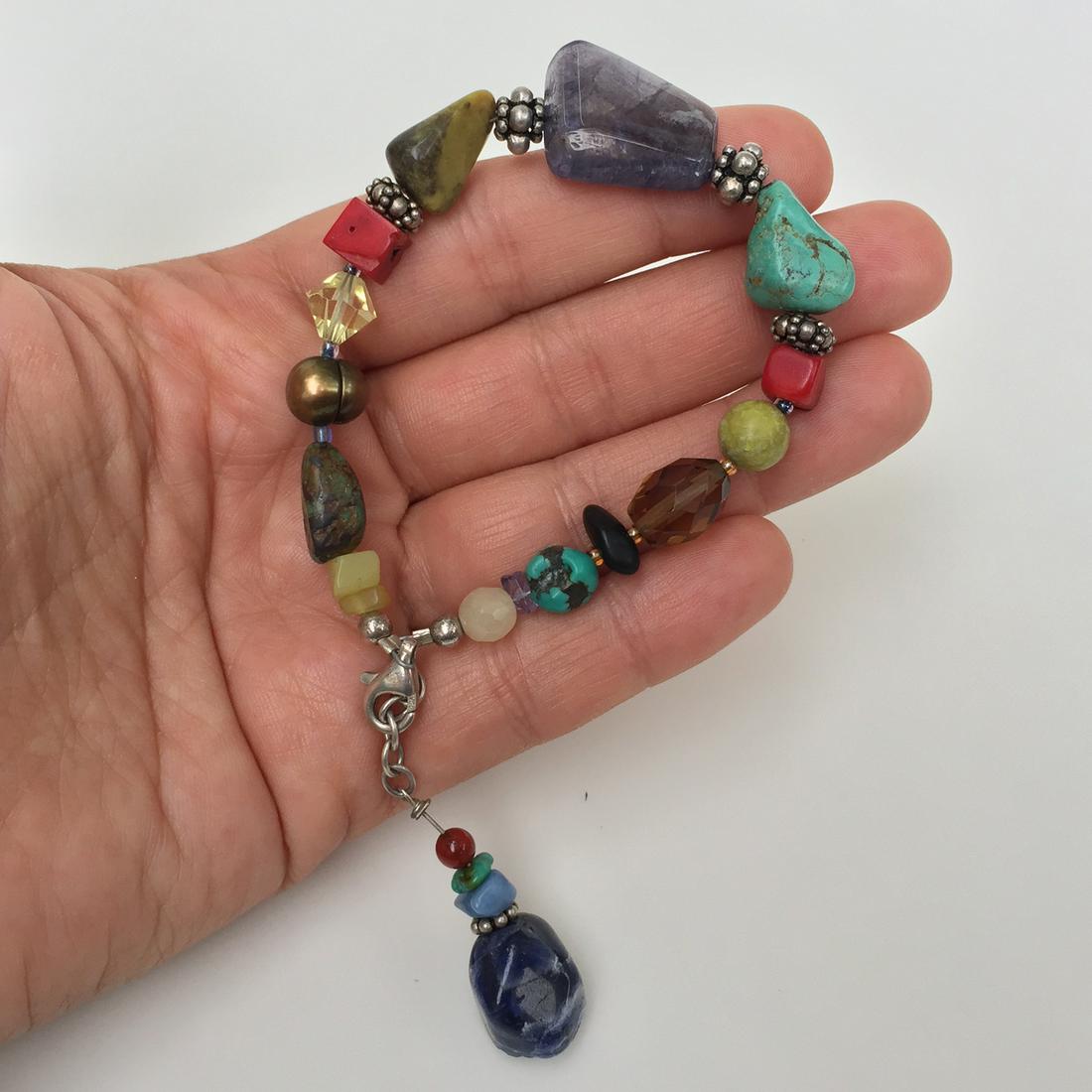 Genuine stones, coral bamboo, sterling silver bracelet: Genuine stones, coral bamboo, pearls, faceted crystal beads and sterling silver bracelet. Length 7 1/2 inches + 1 inches extender. Condition very good.