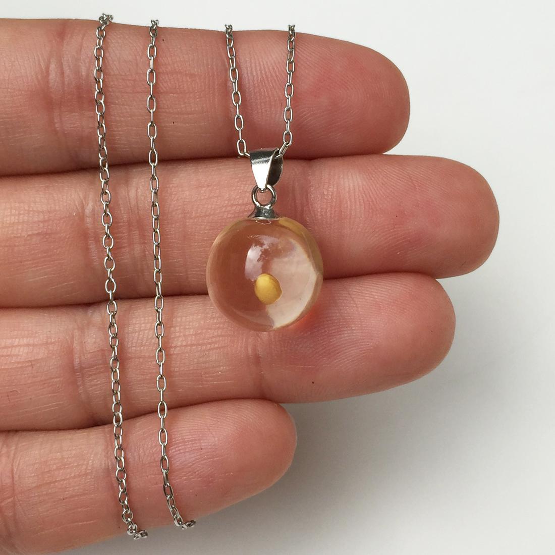 URAL NATURE Sterling silver seed in globe pendant chain: URAL NATURE Sterling silver seed in globe pendant chain. Weight 4.09 grams. Hallmarked 925, chain hallmarked 925 Italy, Ural Nature. Pendant length 7/8 inches with bail. Chain length 19 inches + 2 inc