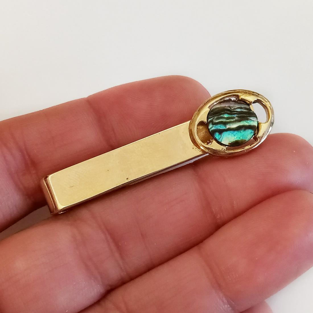 SWANK Vintage gold tone abalone tie clip, signed: SWANK Vintage gold tone abalone tie clip, signed. Length 1 7/8 inches. Hallmarked Swank. Condition very good.