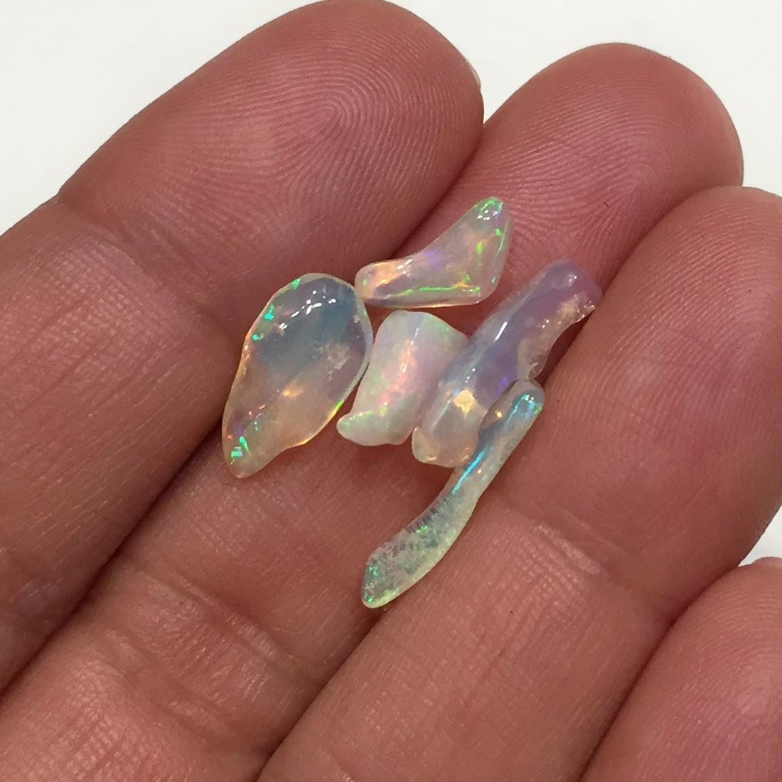 Lot of 5 uncut polished Ethiopian Welo opal, 4.75 cts: Lot of 5 uncut polished Ethiopian Welo opal, total weight 4.75 cts. Opal has very nice play of colors. Country of origin Ethiopia, Africa.
