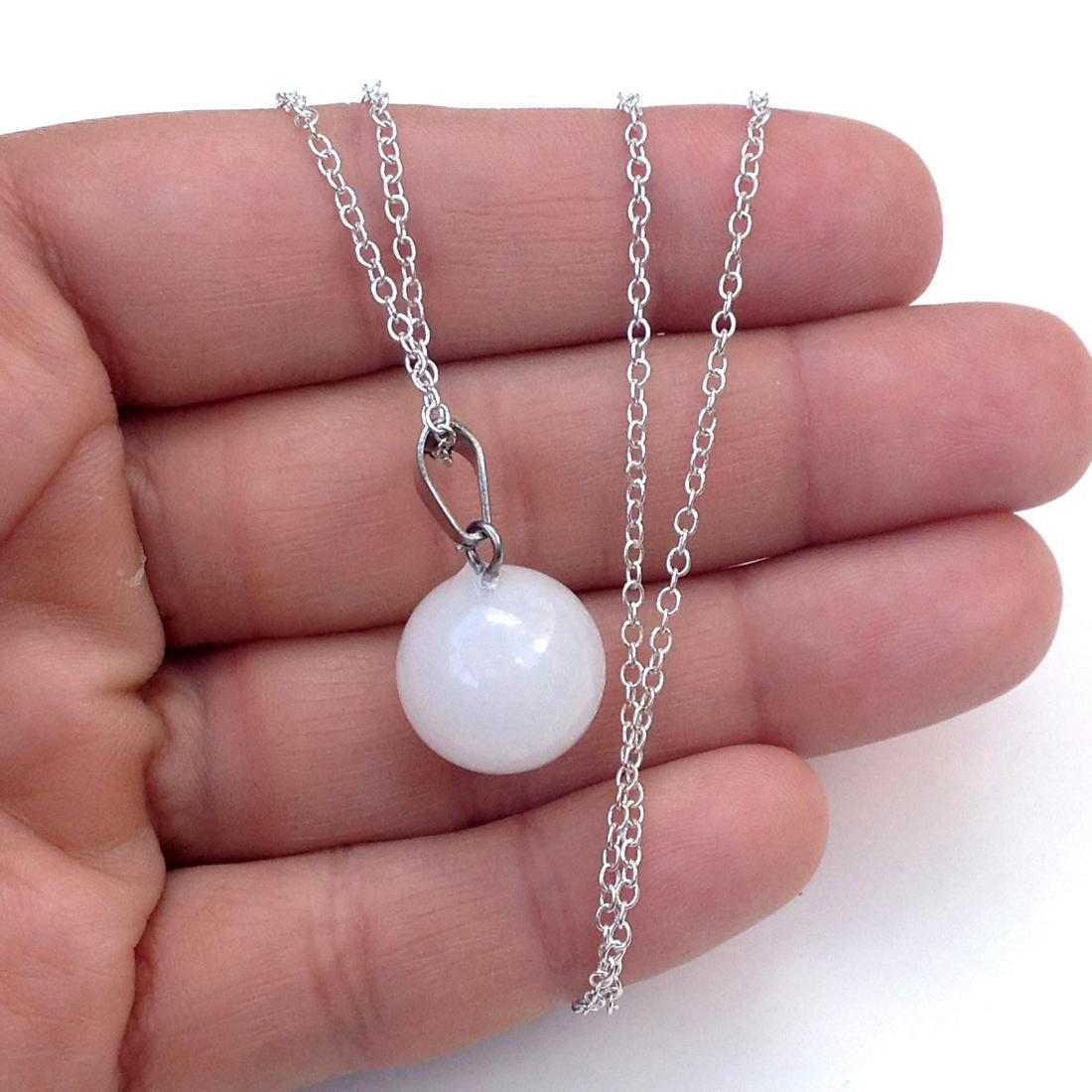 Silver tone chain and white quartz round pendant: Silver tone chain and white quartz round pendant. Chain length 23 1/2 inches. Pendant length 1 inch with bail. Condition excellent.