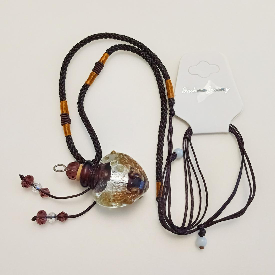 Murano glass style bottle,brown braided cord necklace: Murano glass style silver gold brown textured bottle and brown braided cord pendant necklace. Cord length adjusts from 19 to 25 inches. Pendant length 1 1/2 inches. Condition excellent.