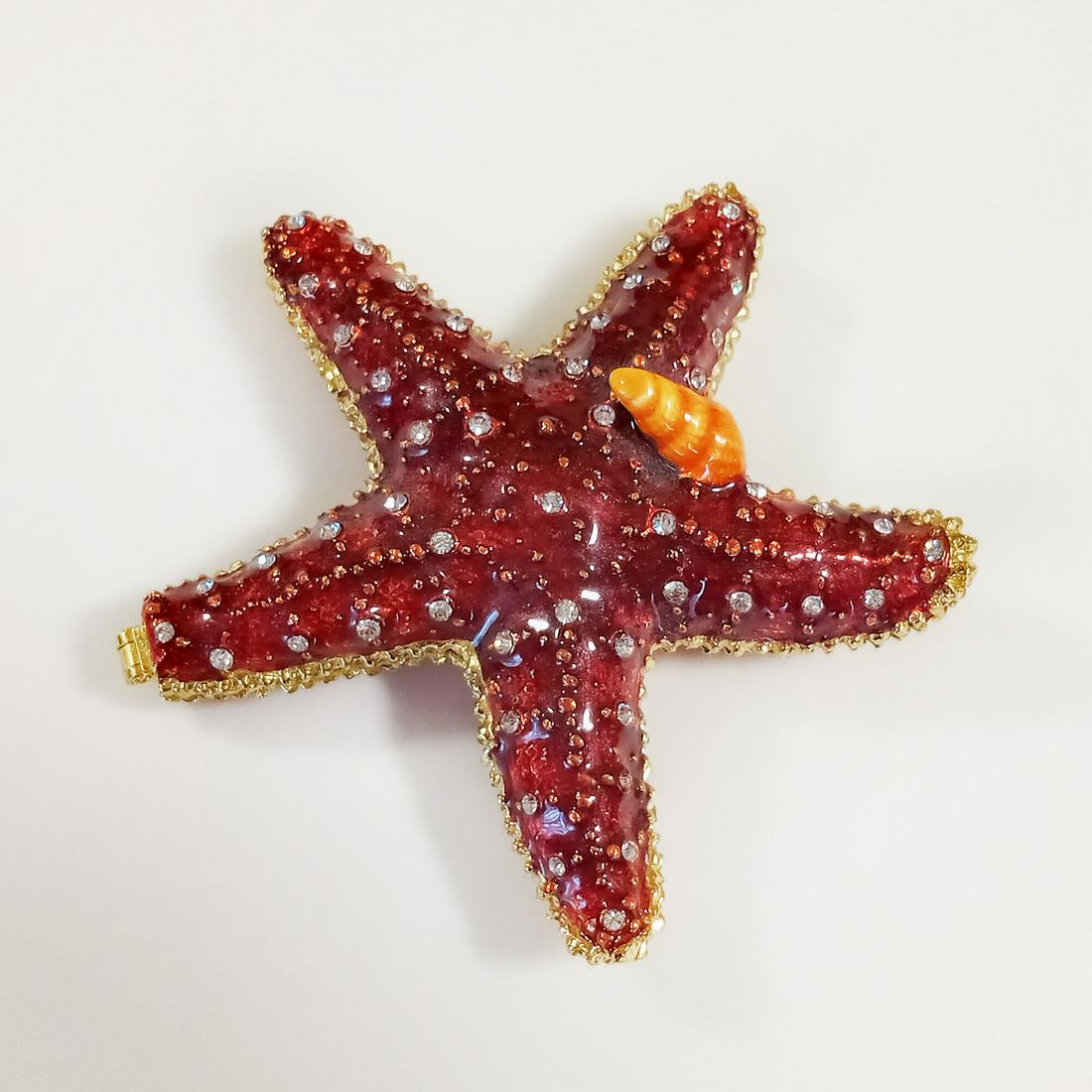 Red enamel, rhinestones Starfish Shell trinket box: Red and orange enamel, clear rhinestones Starfish Shell trinket jewelry box. Measured 3 1/8 x 3 1/4 x 7/8 inches. Condition very good.