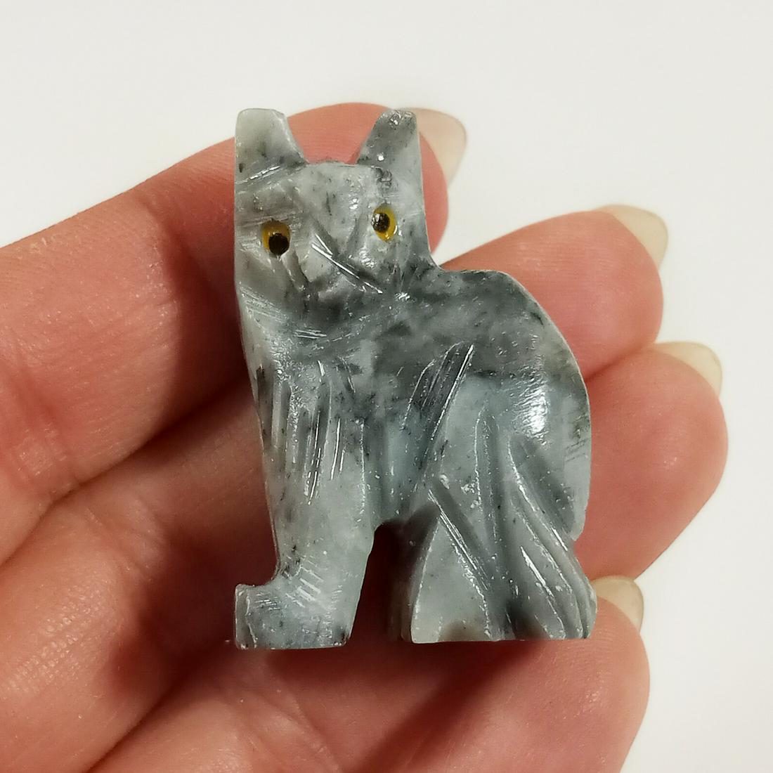 Carved soapstone Kitty Cat mini figurine: Carved gray soapstone Kitty Cat mini figurine. Figurine measured 1 1/2 inch tall. Condition excellent.