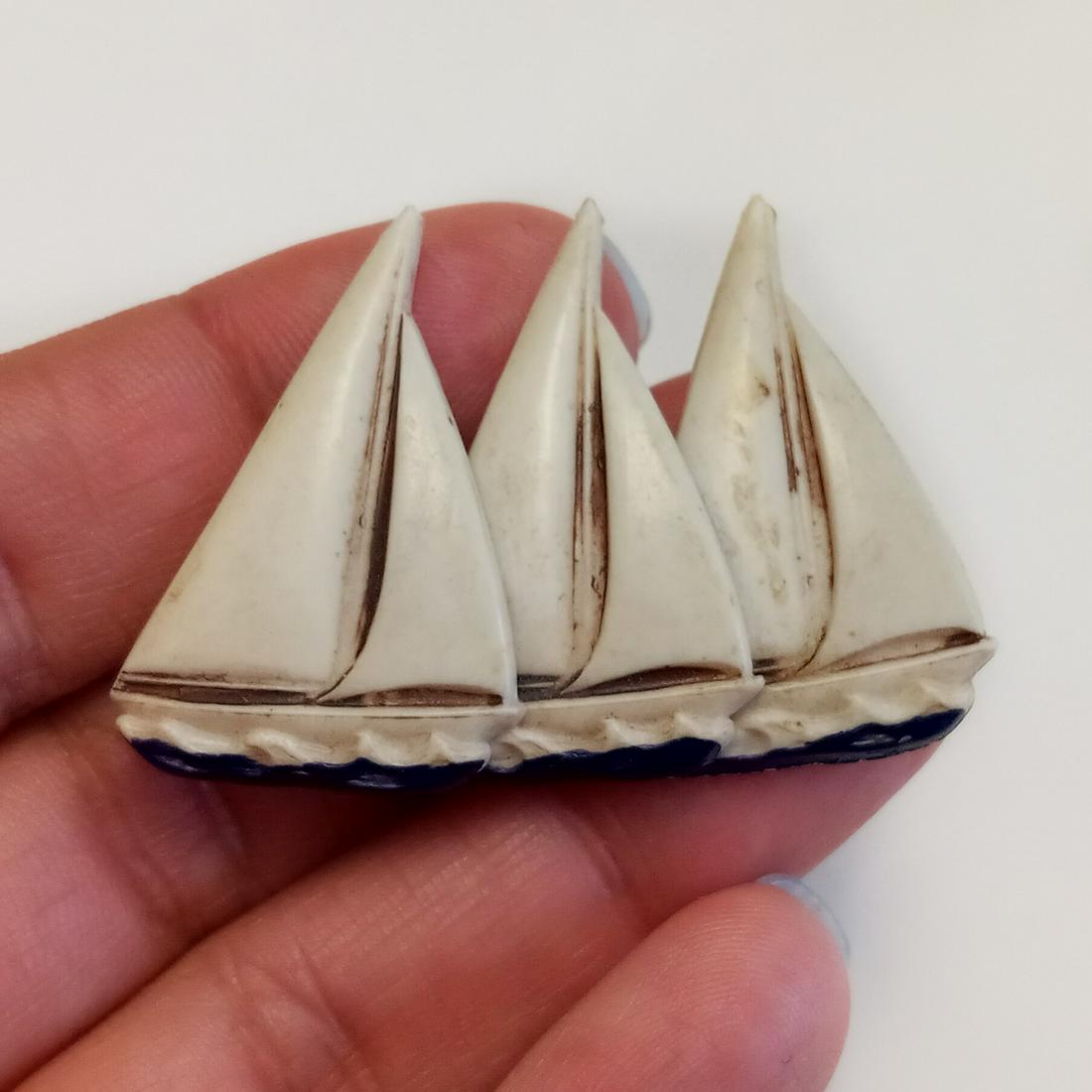 Vintage ivory color acrylic Three Sailboats brooch: Vintage ivory color acrylic Three Sailboats brooch. Measured 1 7/8 x 1 1/4 inches. Condition very good.