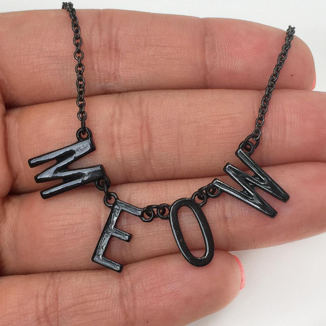 Black tone MEOW chain necklace: Black tone MEOW chain necklace. Necklace length 15 inches + 2 inches extender. Condition excellent.