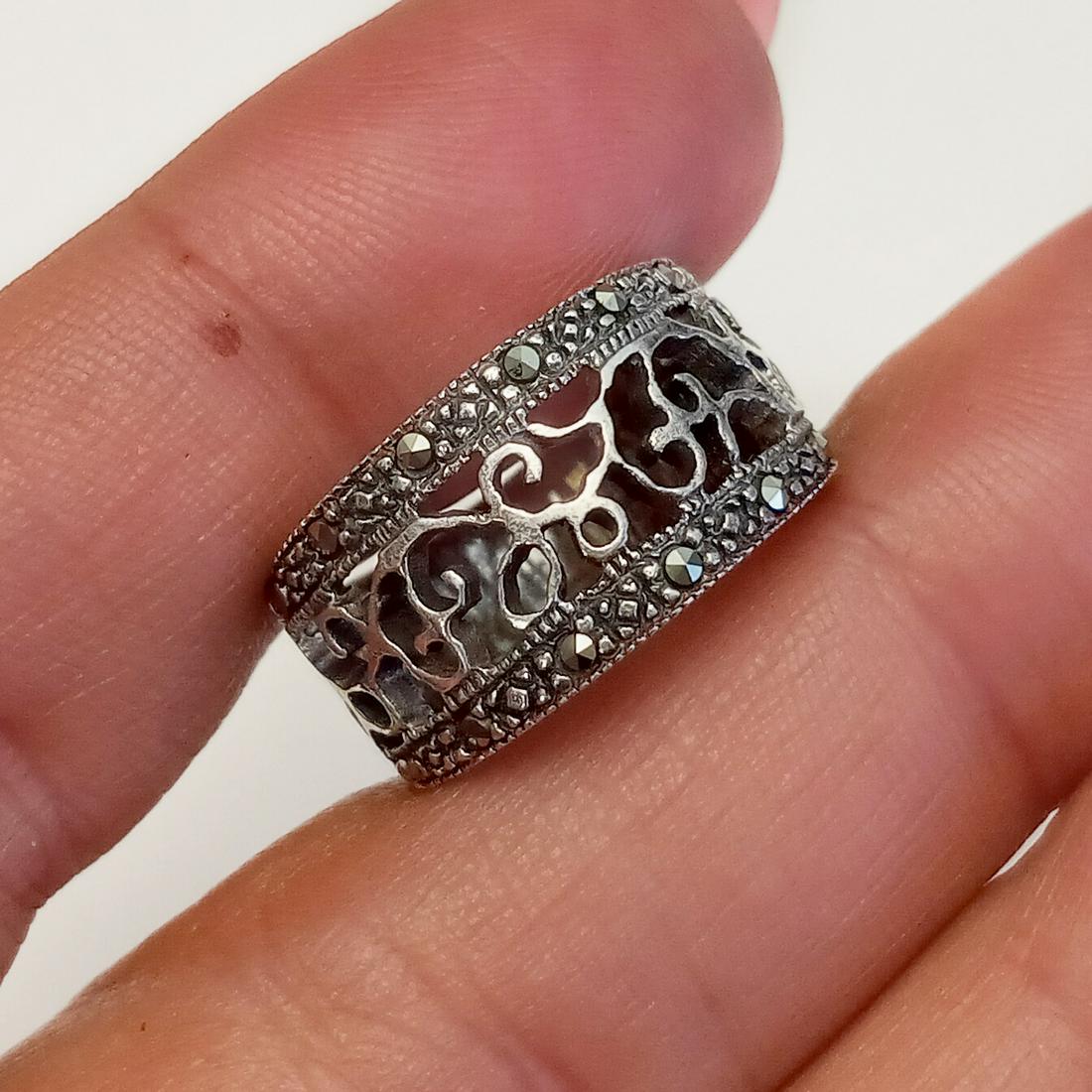 MARSALA Sterling silver marcasites ring, size 5 3/4: MARSALA Sterling silver marcasites swirl accent ring, size 5 3/4, signed. Weight 2.97 grams. Hallmarked 925 M backward C. Condition very good.
