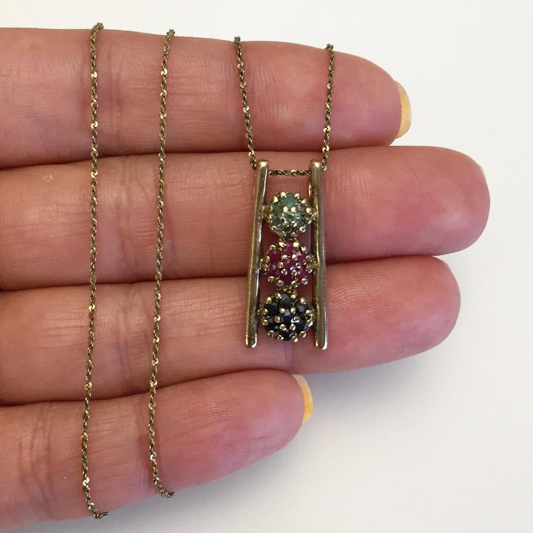 Gold plated sterling silver gemstones pendant chain: Gold plated sterling silver Sapphire Ruby and Emerald Flower pendant and twisted chain necklace. Weight 4.15 grams. Pendant length 1 inch, chain length 18 inches. Hallmarked 925 China. Condition very 
