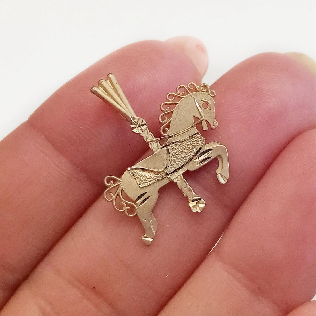 14k yellow gold Carousel Horse pendant: 14k yellow gold matte and textured finish Carousel Horse pendant. Weight 1.2 grams. Length 7/8 inches with bail. Hallmarked 14K, 89, Ma,©. Condition excellent.