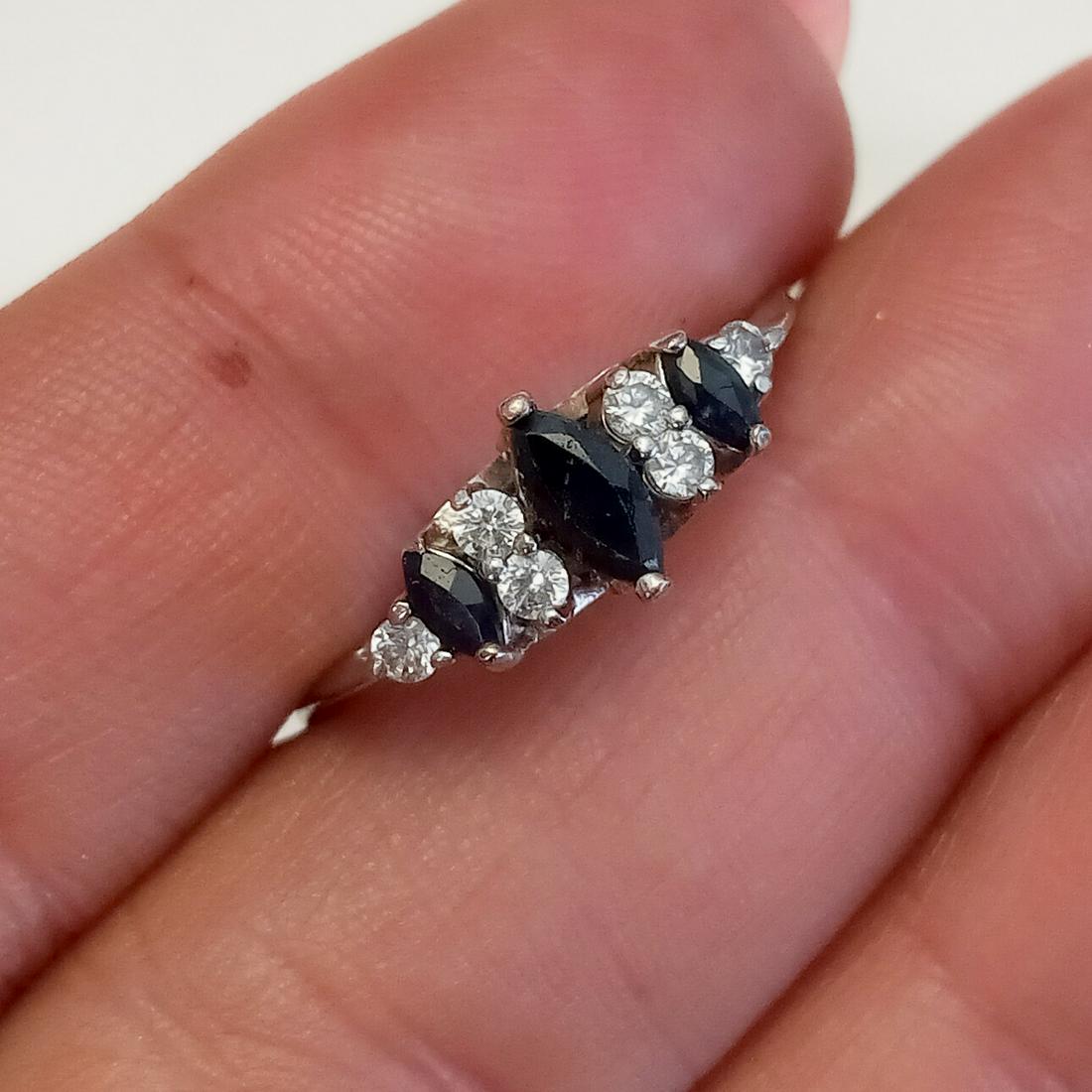 Sterling silver marquise blue sapphire, CZ ring: Sterling silver marquise blue sapphire and CZ ring. Size 8 1/2. Weight 2.06 grams. Hallmarked A 925. Condition very good.