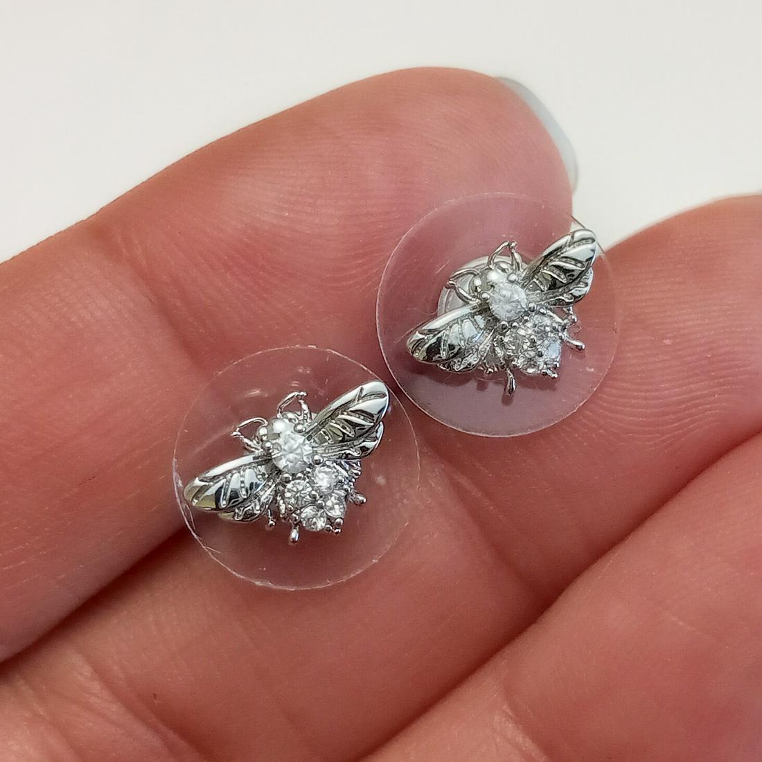 SIMPLY VERA WANG Silver tone Fly Bee CZ earrings: SIMPLY VERA WANG Silver tone Fly Bee Insect shape clear CZ push back stud earrings. Measured 3/8 x 1/8 inches. Condition excellent.