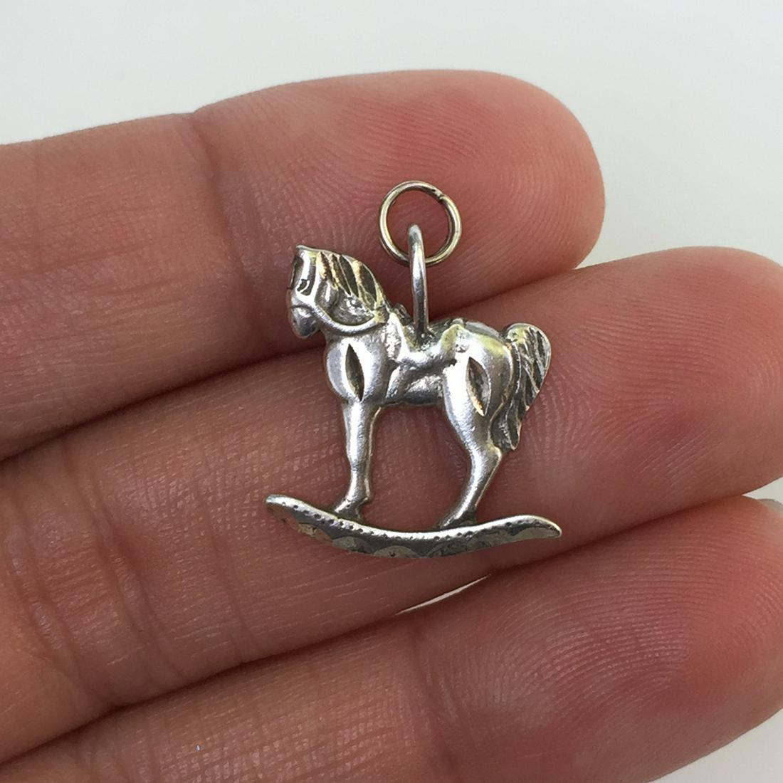 Sterling silver Rocking Horse pendant charm: Sterling silver Rocking Horse pendant charm. Weight 1.30 grams. Hallmarked 925. Length 1 inch with bail. Condition very good.