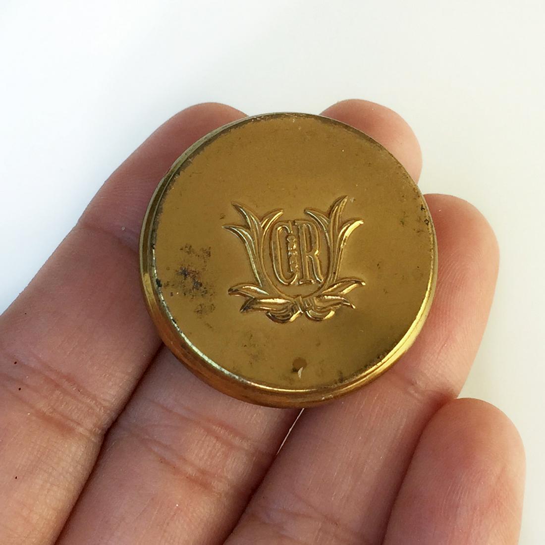 CHARLES OF THE RITZ Vtg gold tone mini powder compact: CHARLES OF THE RITZ Vintage gold tone mini powder compact round shape trinket with mirror and powder puff. Measured 1 1/8 inches in diameter. Hallmarked Charles of the Ritz, New York. Condition very g