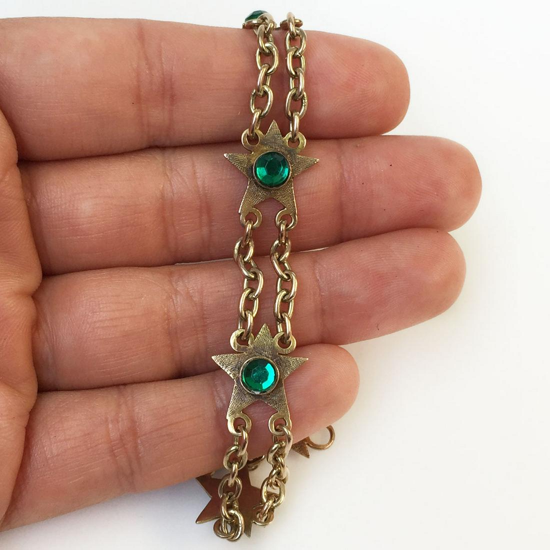 Gold tone green rhinestone Star chain bracelet: Gold tone green rhinestone Star chain bracelet. Length 7 1/2 inches. Condition good.