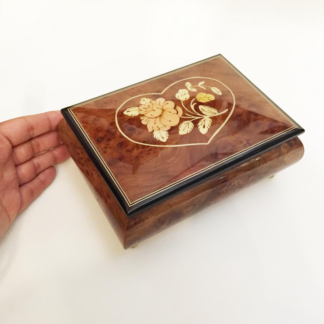 SAN FRANCISCO MUSIC BOX COMPANY Music Box: SAN FRANCISCO MUSIC BOX COMPANY Music Box. Distinctive Inlaid Wooden Music box hand-crafted in Sorrento, Italy. Created by Doneto and Maresca. Measured 6 3/4 x 4 3/4 x 2 1/2 inches. Beautiful Flower i