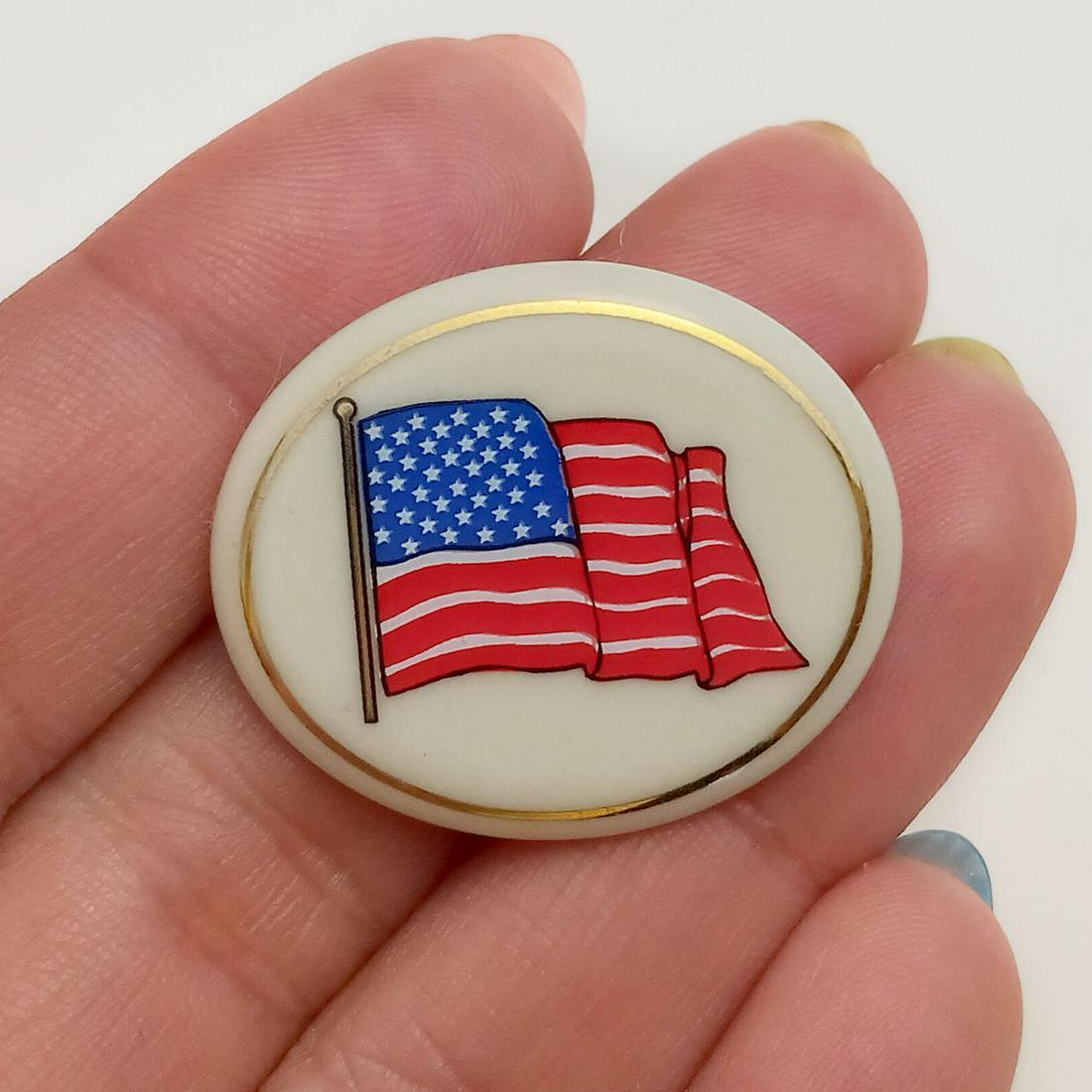 LENOX: Porcelain USA American Flag oval brooch: LENOX: Porcelain USA American Flag oval shape brooch, signed. Measured 1 1/8 x 1 inches. Hallmarked Lenox ®USA. Condition very good.