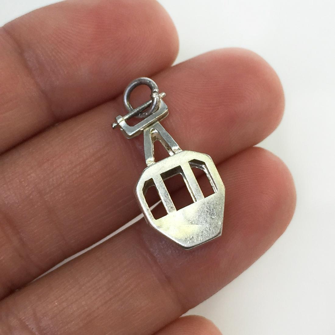 Silver Gondola shape pendant charm: Sterling silver Gondola shape pendant charm. Weight 1.59 grams. Hallmarked 800. Length 1 inch with bail.