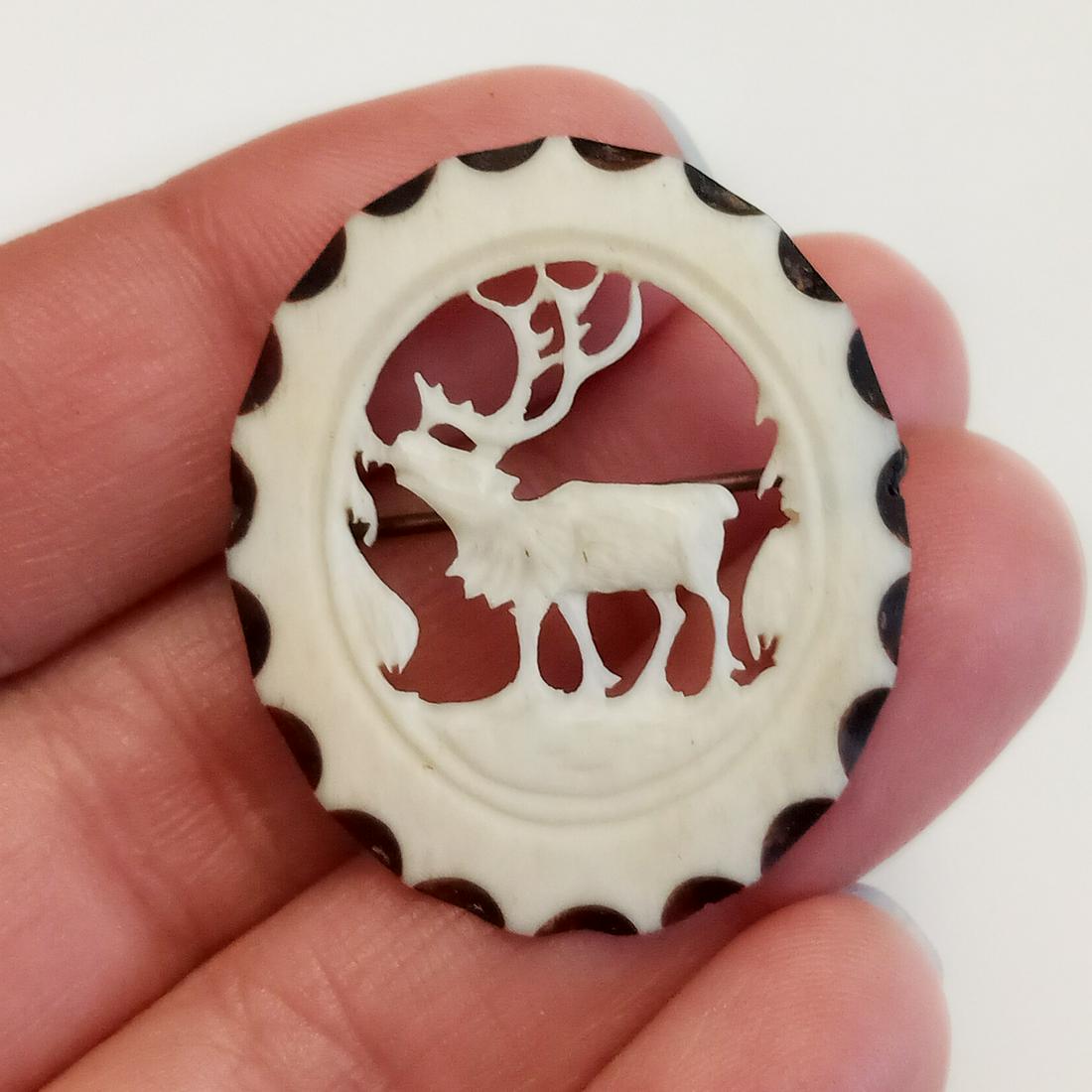 Vintage carved bone color Stag Elk Deer brooch: Vintage acrylic carved bone color, ivory color look Stag Elk Deer oval shape brooch. Measured 1 3/8 x 1 1/8 inches. Condition very good.