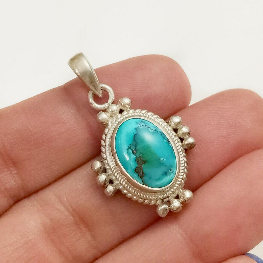 Sterling silver oval turquoise color cabochon pendant: Sterling silver oval turquoise color cabochon pendant. Weight 6.75 grams. Length 1 3/8 inches with bail. Hallmarked 925. Stone is more than likely dyed magnesite. Condition very good.