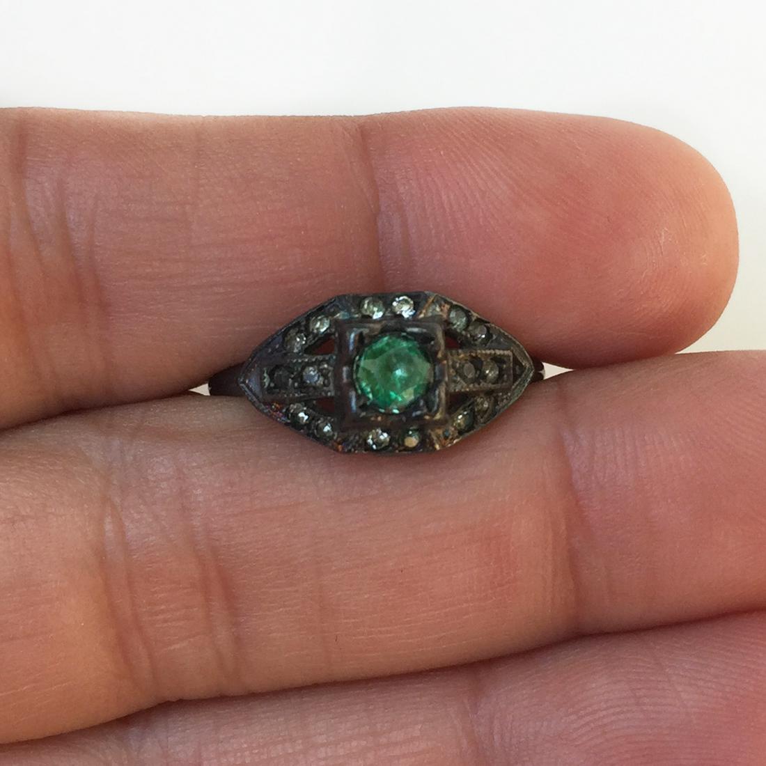 Oxidized sterling silver clear green crystal ring: Oxidized sterling silver clear green crystal ring. Size 8. Weight 1.84 grams. Hallmarked Sterling, U with arrow through it. Condition very good.