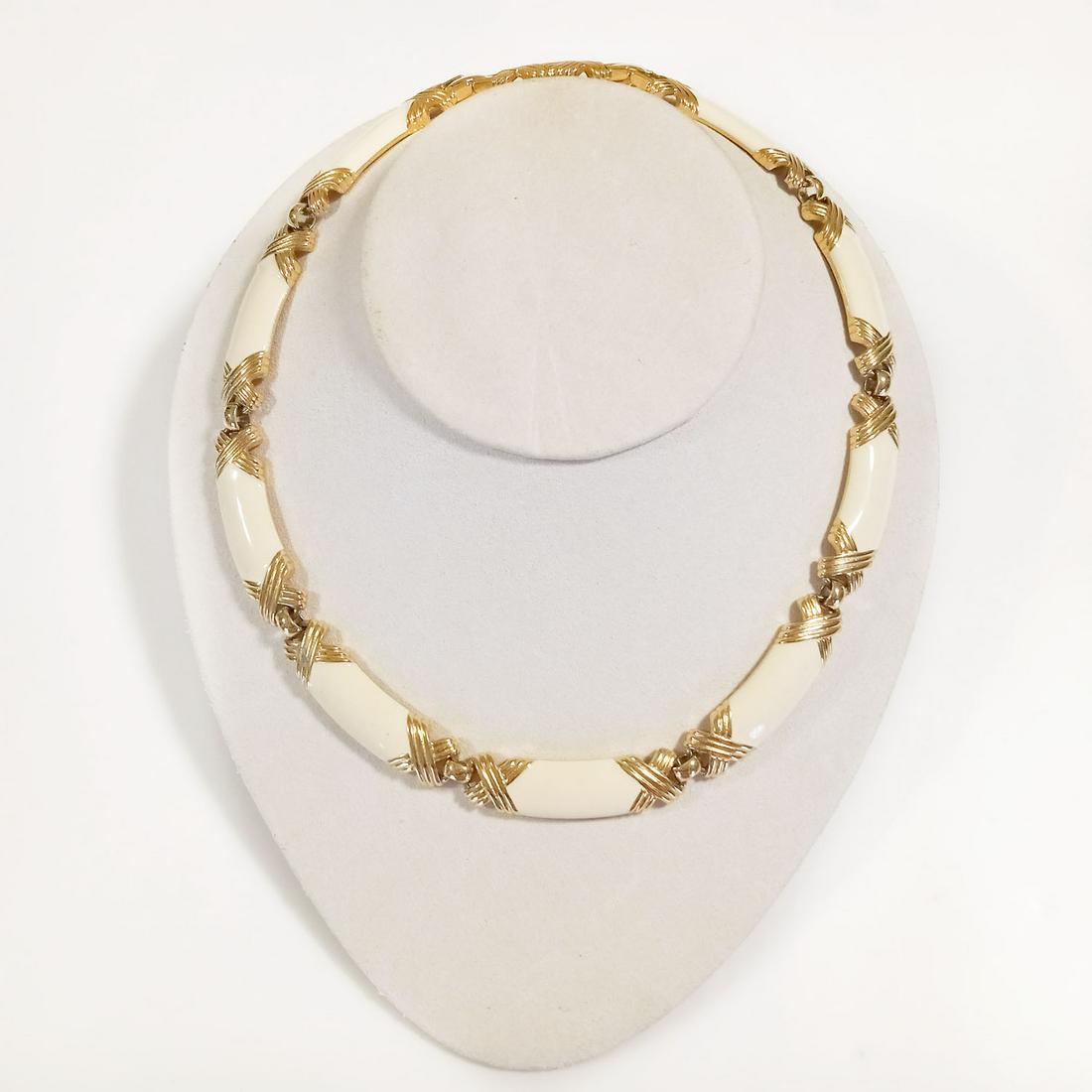 MONET Vintage gold tone enamel X accent necklace: MONET Vintage gold tone cream enamel and X textured accents necklace, signed. Length 16 inches to 17 inches. Width measured 3/8 inches. Hallmarked MONET copyright logo. Condition very good.