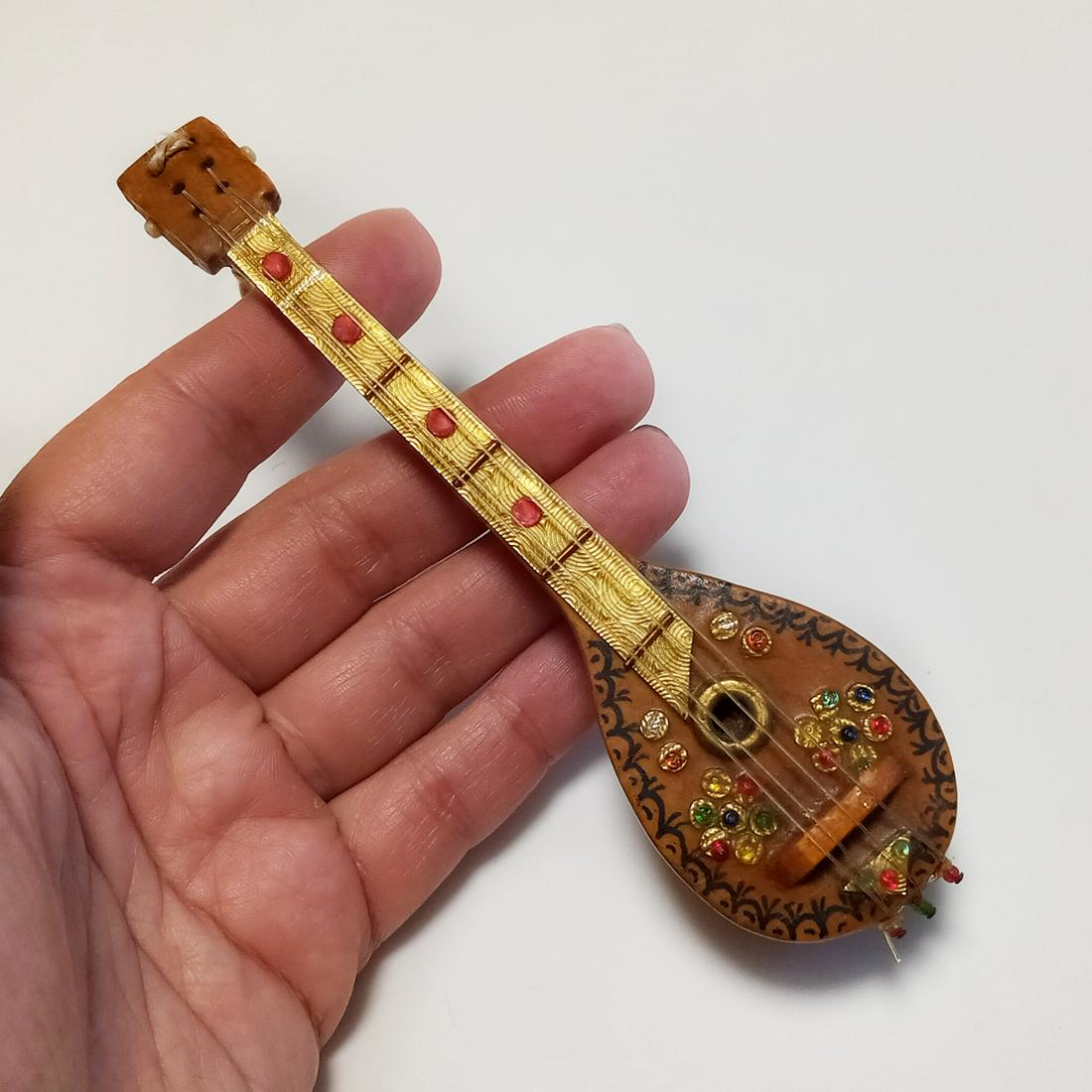 Miniature wood beads gold tone inlay Mandolin trinket: Miniature wood multicolor beads and gold tone inlay Mandolin music instrument theme trinket. Measured 5 1/4 x 1 1/2 inches. Condition very good.