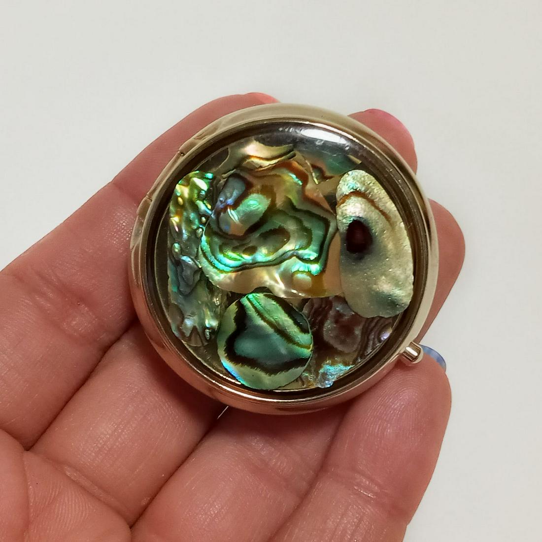 Gold tone Abalone round shape pill mint trinket box: Gold tone Abalone round shape pill mint trinket box. Measured 1 1/2 inches in diameter. Condition very good.