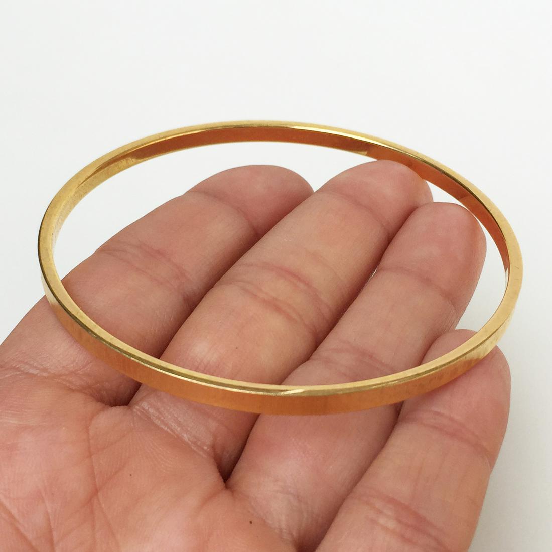 MONET: Gold tone textured finish bangle bracelet: MONET: Gold tone textured finish bangle bracelet. Hallmarked © MONET I or 1. Bangle is 1/8 inches wide. Condition very good