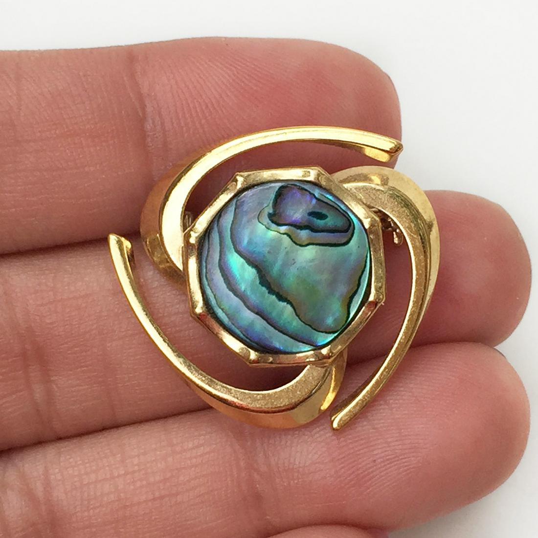 Gold tone Abalone triangle shape brooch: Gold tone Abalone triangle shape brooch. Measured 1 x 1 inch. Condition excellent.