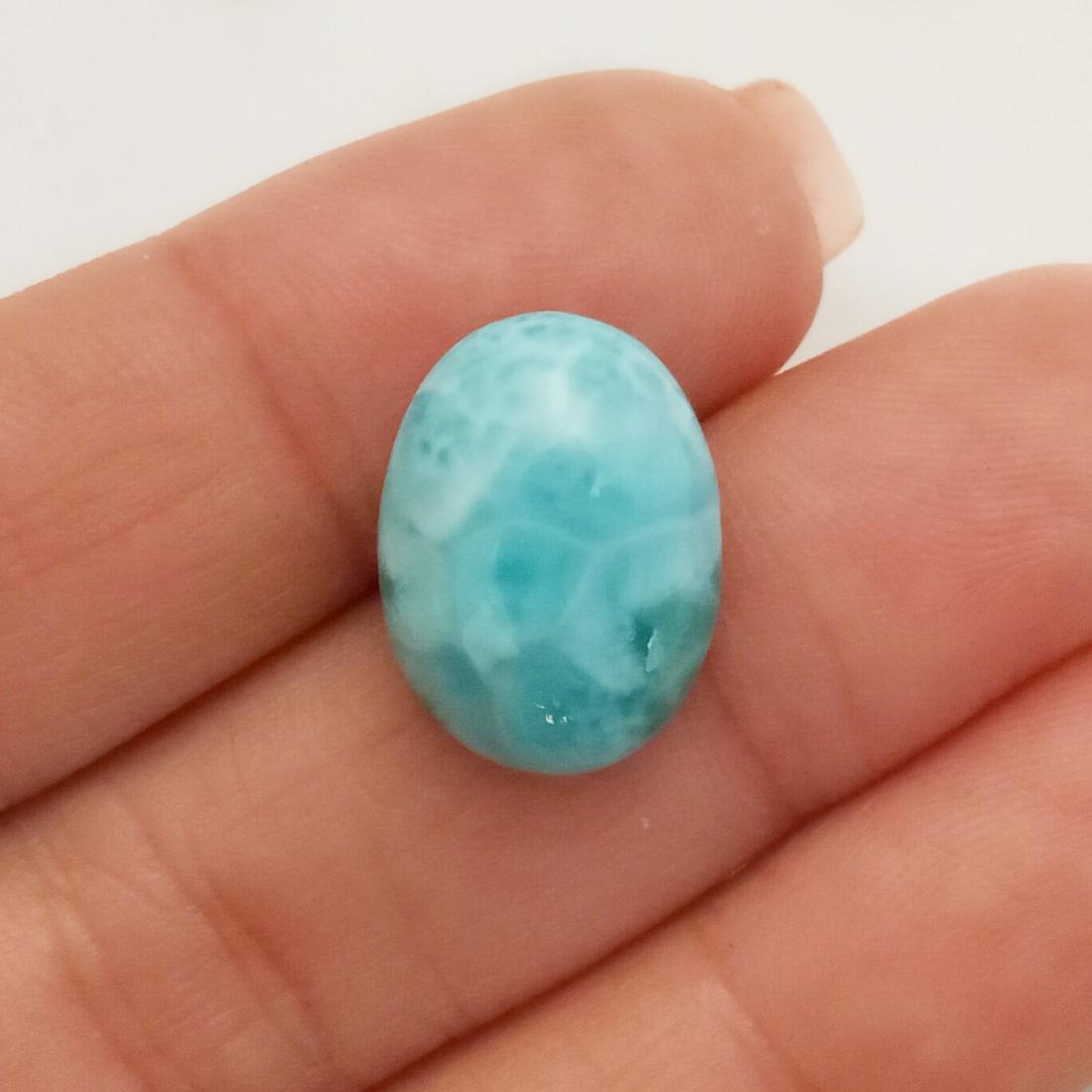 Oval shape natural Larimar cabochon, weight 13.05 cts: Oval shape natural Larimar cabochon, weight 13.05 cts. Measured 16.4 x 12.3 x 7 mm. Stone has beautiful blue color and natural design. Country of origin Dominican Republic.