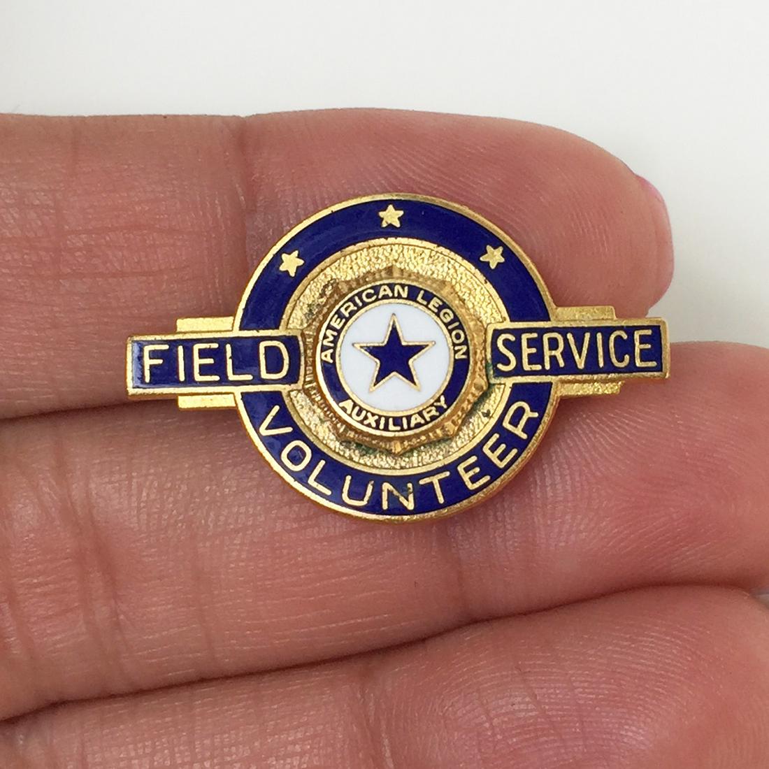 Vintage Field Service Volunteer blue enamel pin brooch: Vintage gold tone Field Service Volunteer, American Legion Auxiliary blue enamel pin brooch. Measured 1 1/4 x 3/4 inches. Condition very good.