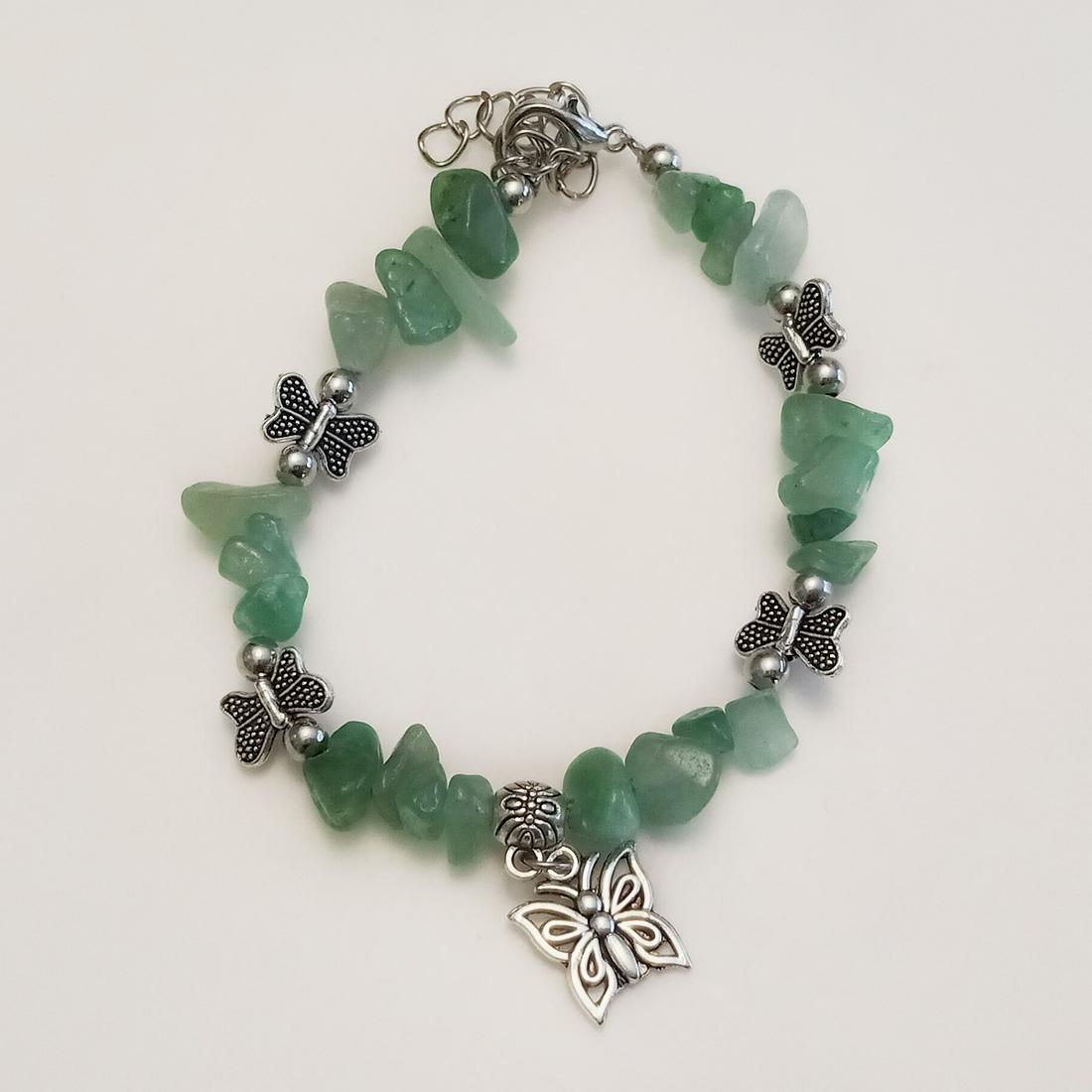 Silver tone aventurine chip beads, Butterfly bracelet: Silver tone aventurine chip beads and Butterfly charms bracelet. Length 7 inches + 2 inches extender. Chips measured approximately 1/8 - 1/4 inches in length. Condition excellent.