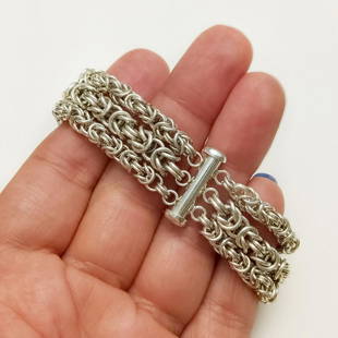 Sterling silver triple Byzantine chain bracelet: Sterling silver triple Byzantine chain bracelet. Weight 42.3 grams. Length 6 1/4 inches. Width 5/8 inches. Hallmarked 925. Condition very good.