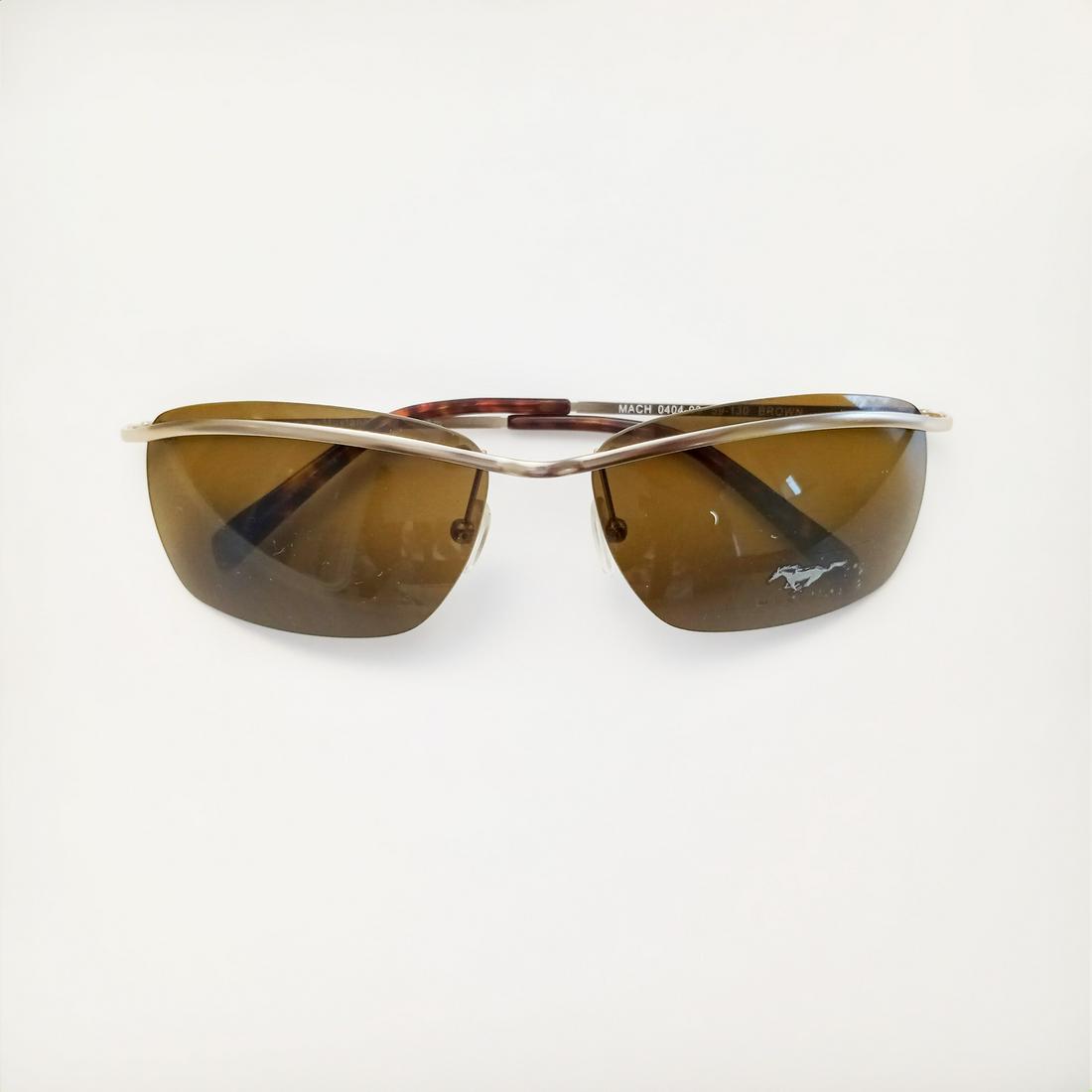 MUSTANG EYEWEAR Gold tone brown rectangular sunglasses: MUSTANG EYEWEAR Gold tone brown rectangular sunglasses MACH 0404-03 59-130. www.mymustangeyewear.com on the side. Condition very good.