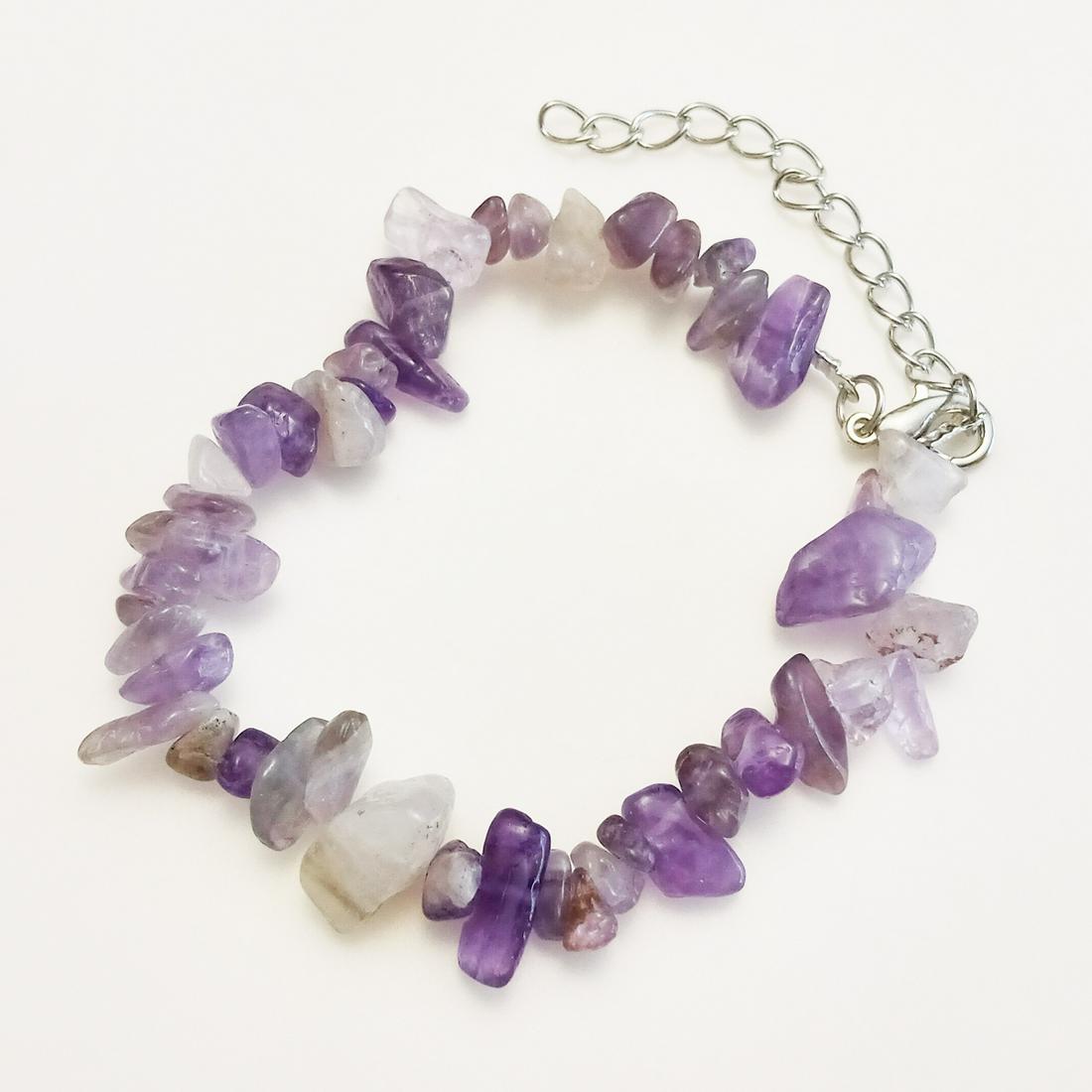 Silver tone amethyst chip beads bracelet: Silver tone genine amethyst chip beads bracelet. Length 7 1/4 inches + 2 inches extender. Chips measured from 1/8 to 1/2 inches in length. Condition excellent.