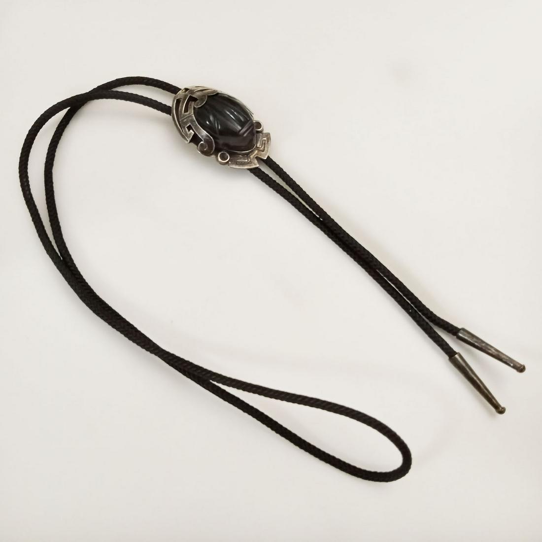 Vintage sterling silver carved face black cord Bolo tie (1 of 4)