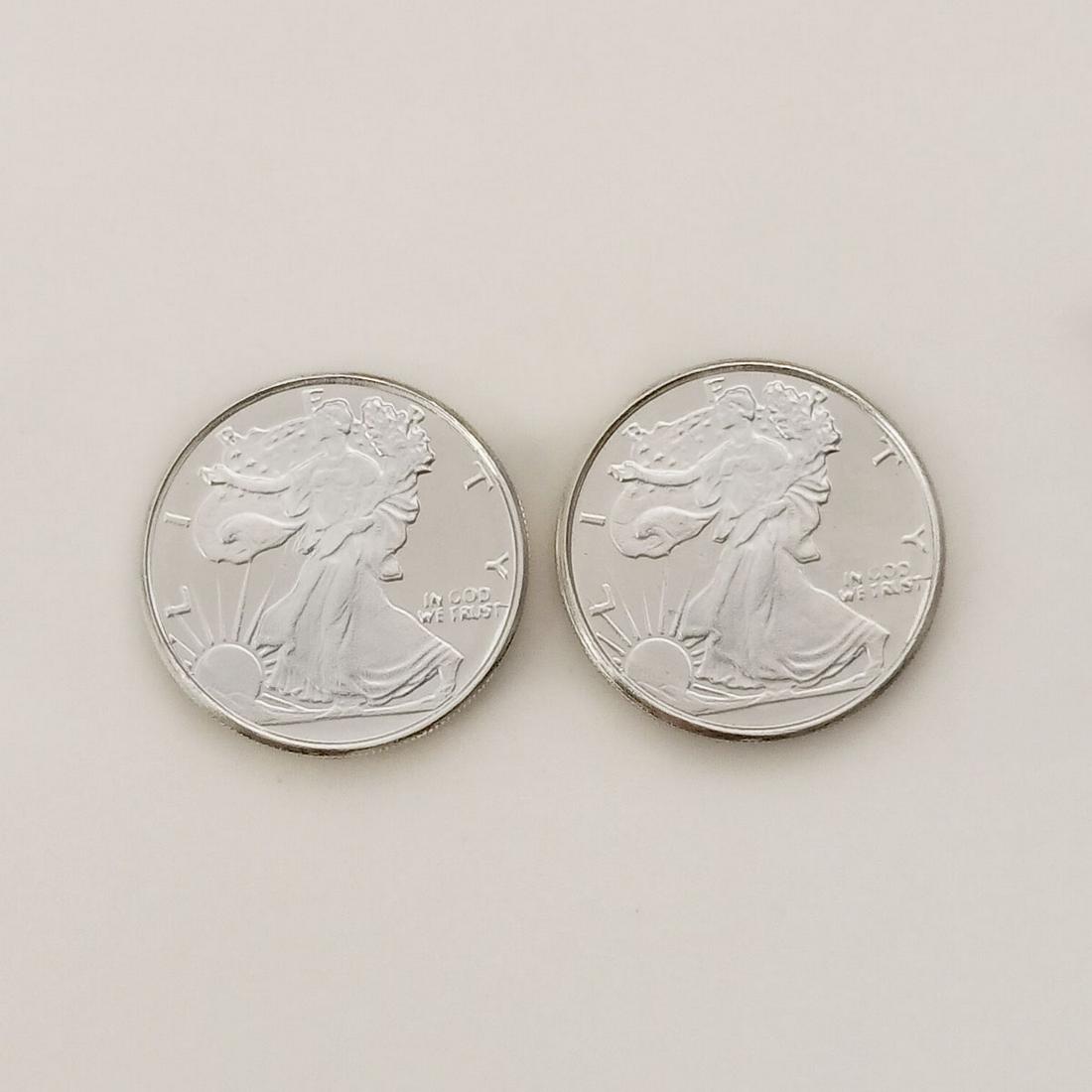 Lot of 2 US Walking Liberty 1/10 oz Fine silver rounds: Lot of 2 Collectible United States Walking Liberty American Eagle 1/10 troy oz .999 Fine Silver rounds bullions. Each is: 1/10 .999 fine silver, 18 mm round. Pure silver 1/10 oz Walking Liberty Rounds