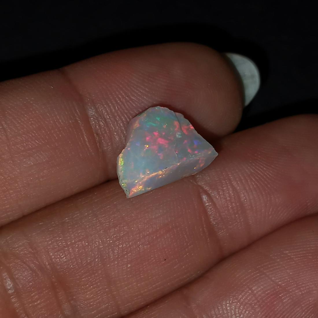 Raw rough free shape Welo Opal, weight 3.45 cts: Raw rough free shape Welo Opal, weight 3.45 cts. Measured approximately 12.9 mm x 9.4 mm. Opal has very nice play of colors.