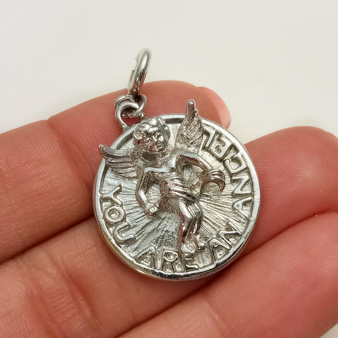 Silver tone Cherub You are an Angel round charm: Silver tone Cherub You are an Angel round charm with spring clasp. Length 1 1/2 inches with spring clasp. Condition very good.